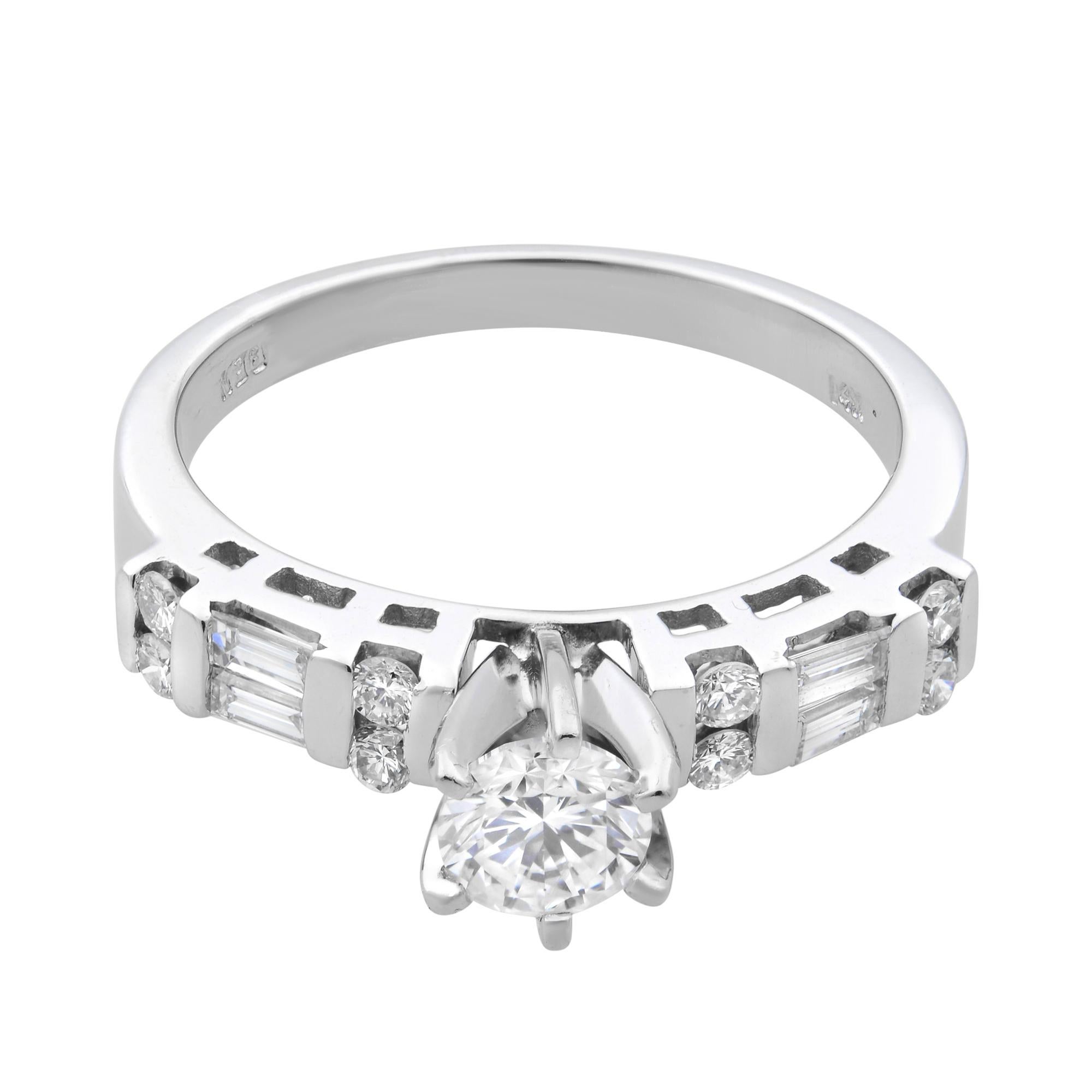 This beautiful and alluring engagement ring features a center round brilliant cut diamond weighing 0.50 carat in prong setting, flanked by Baguette and round cut diamonds on ring shoulders to add more beauty. Crafted in highly polished 14k white