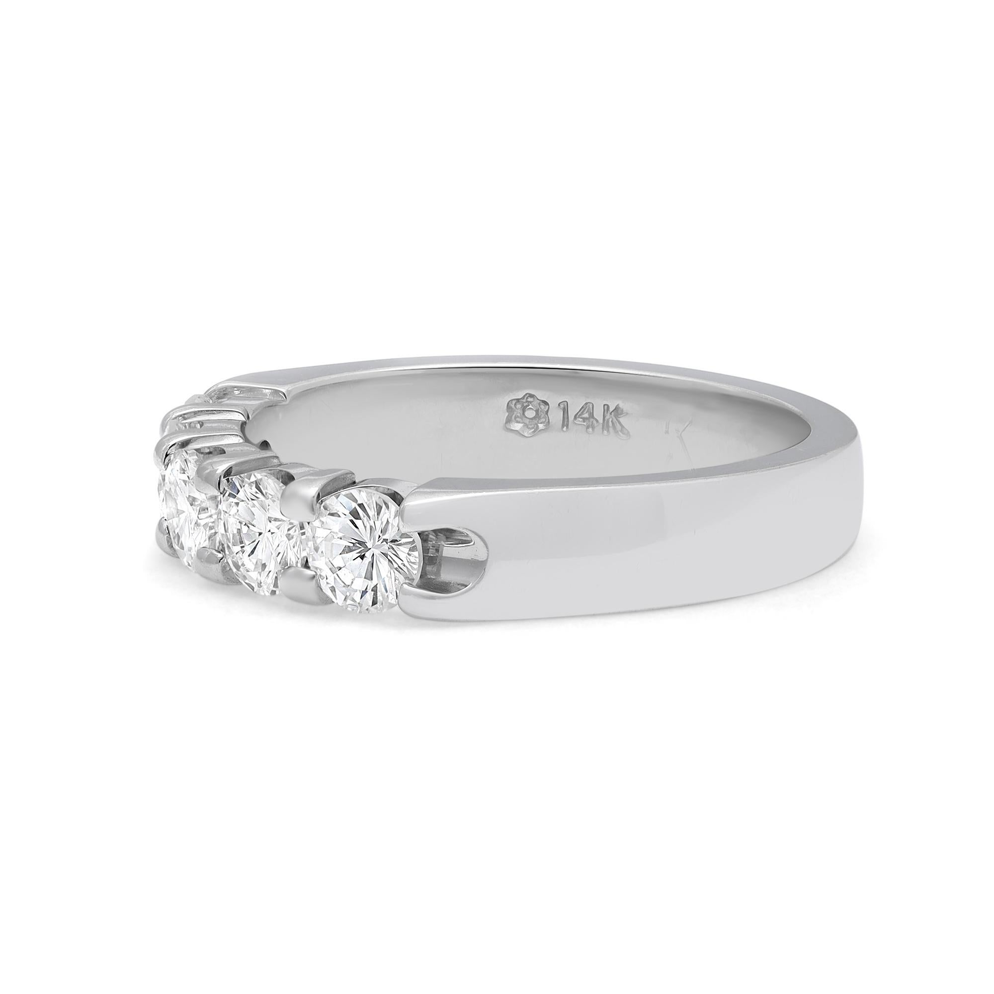 Gorgeous diamond band ring, crafted in highly polished 14k white gold. This timeless wedding band is encrusted with 5 round brilliant cut dazzling diamonds in a shared prong setting. Total diamond weight: 1.00 carat. Diamond color G and VS-SI
