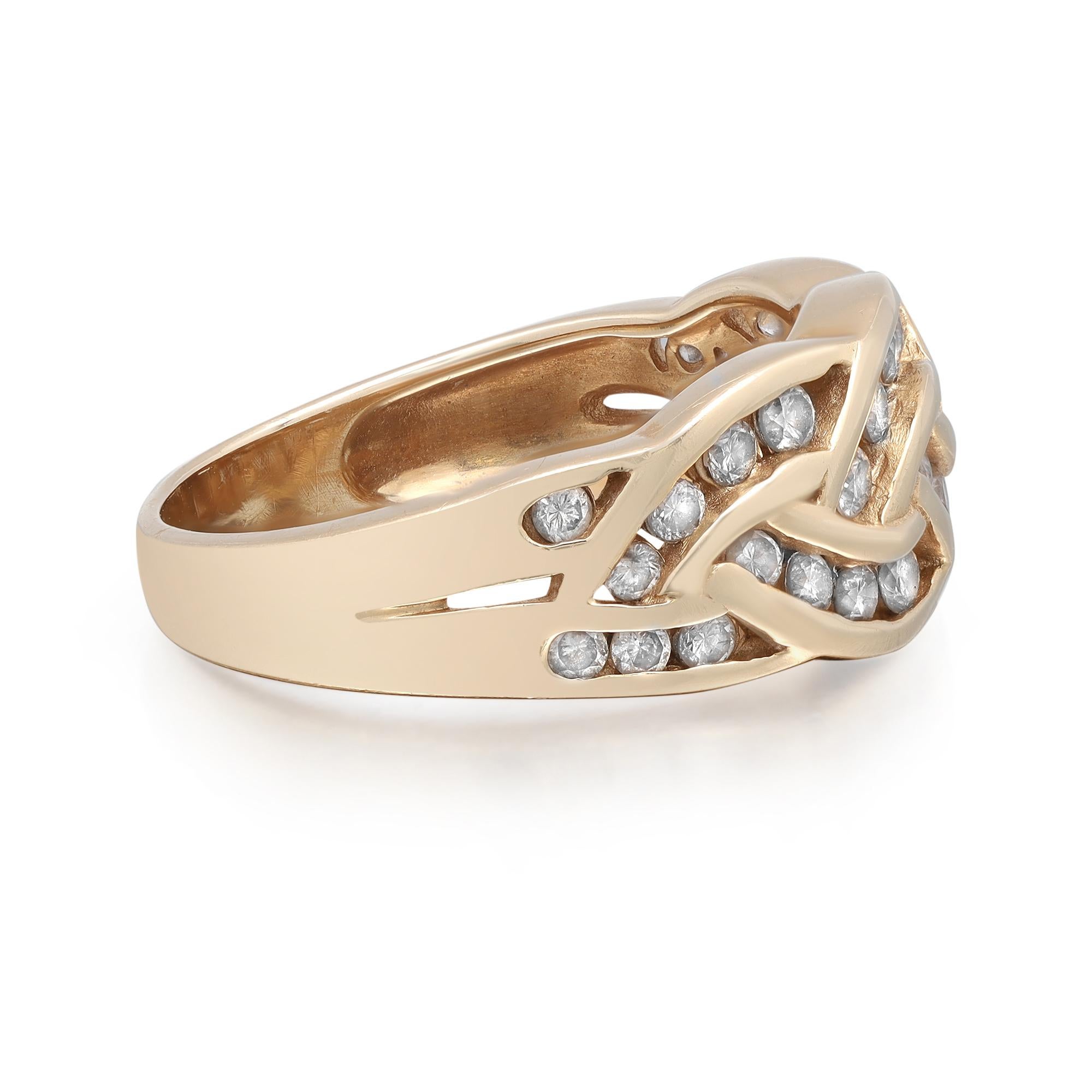 This gorgeous diamond band ring is crafted in 14k yellow gold with dazzling round cut diamonds in channel setting giving the ring a very unique feminine style. Total diamond weight: 1.05 carats. The ring is size 7.25. Total weight: 4.96 grams. Great