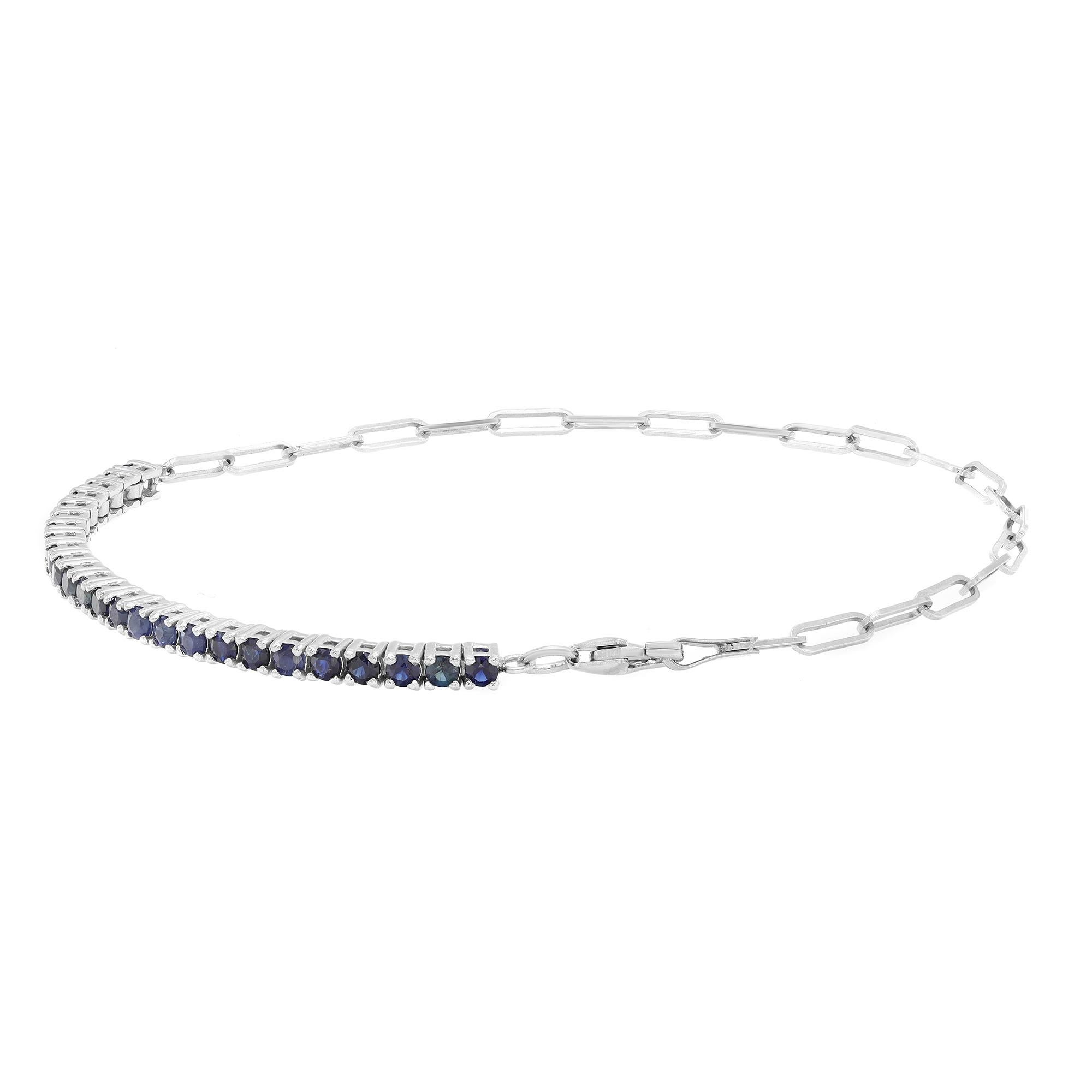 This beautifully crafted tennis bracelet features round cut blue Sapphire set half way in four prong setting with link chain on the other half. Crafted in 14k white gold. Total sapphire weight: 1.16 carats. Length: 6.5 inches. Width: 2.3 mm. Total