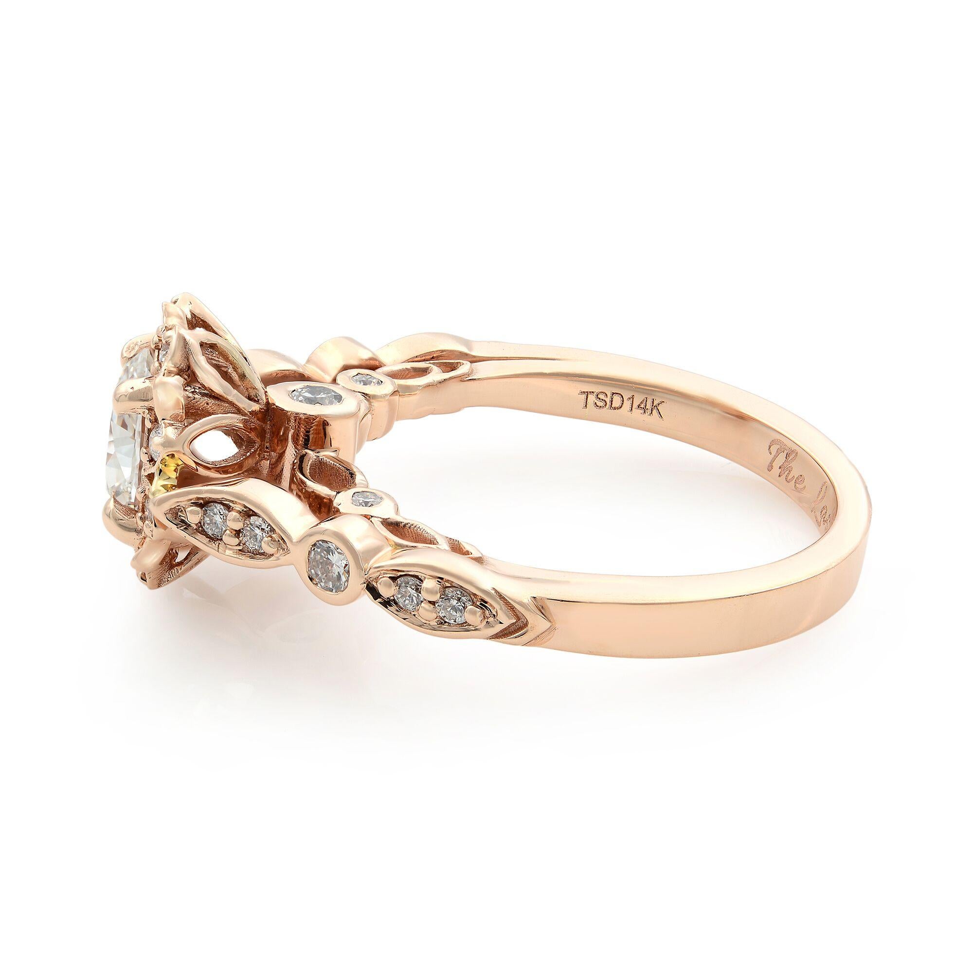 This is a rose gold oval halo engagement ring. Twenty-four tiny round cut diamonds, at approximately 0.25 carat total weight, are beautifully crafted in quality 14 karat rose gold. This piece creates a dazzling display by choosing an oval center