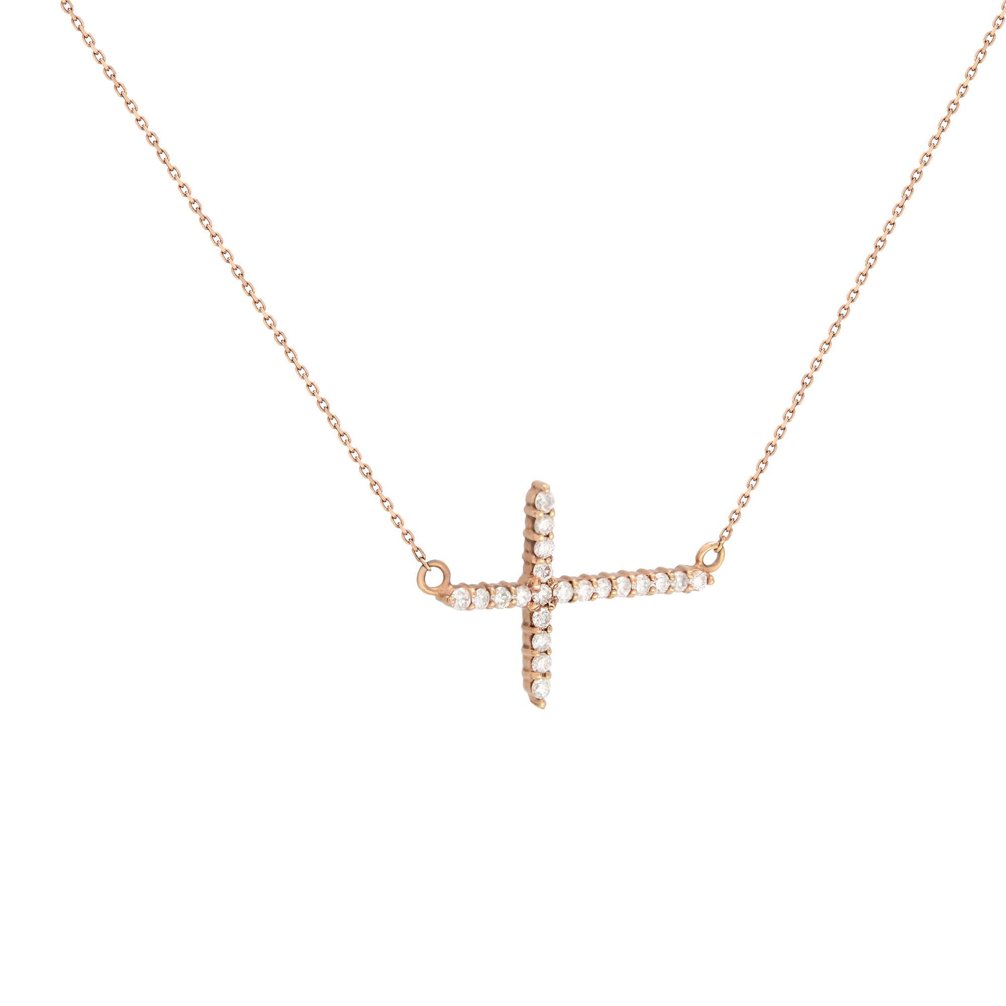 A delicate diamond 0.28cttw side way cross pendant. Includes 21 tiny brilliant round cut diamonds. Diamond color G-H Color and VS-SI Clarity. The diamonds are beautifully set in a prong setting. Cross size:  20x15mm. Thickness: 1.75mm. Chain length: