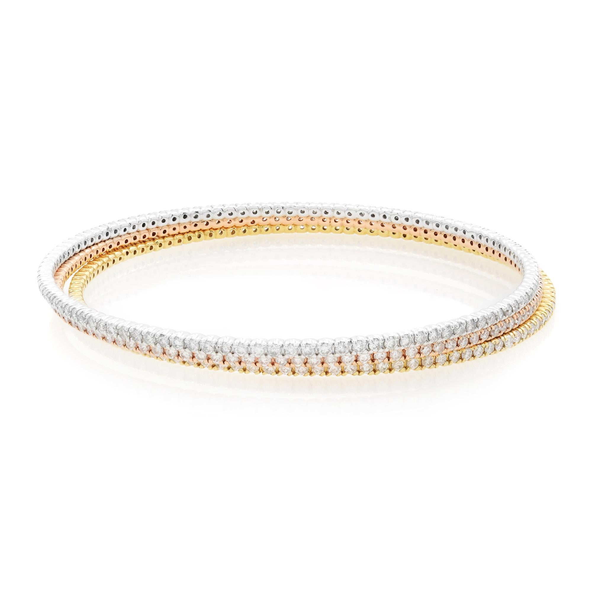 14K white, yellow and rose gold bangle bracelet. This tri color diamond 3 piece bangle set is the perfect way to mix and match your metals for everyday wear. This piece is set with approximately 6.04cttw. Diamond color G and VS clarity.  Length: 7.5