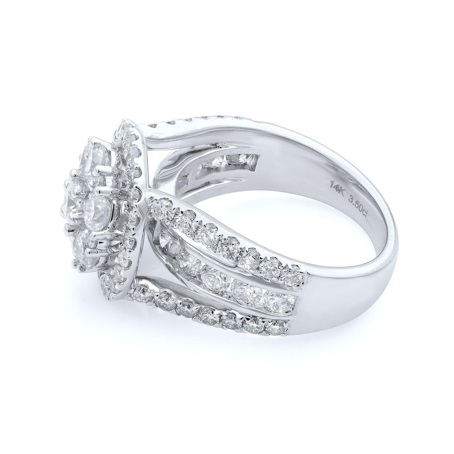 This beautifully cut round brilliant natural diamonds is nestled in diamond encrusted flower motif engagement ring design. The solid 18K white gold setting boasts a 3.50 carat round of diamonds. Diamonds are VS1 clarity and G color. Ring size 7.
