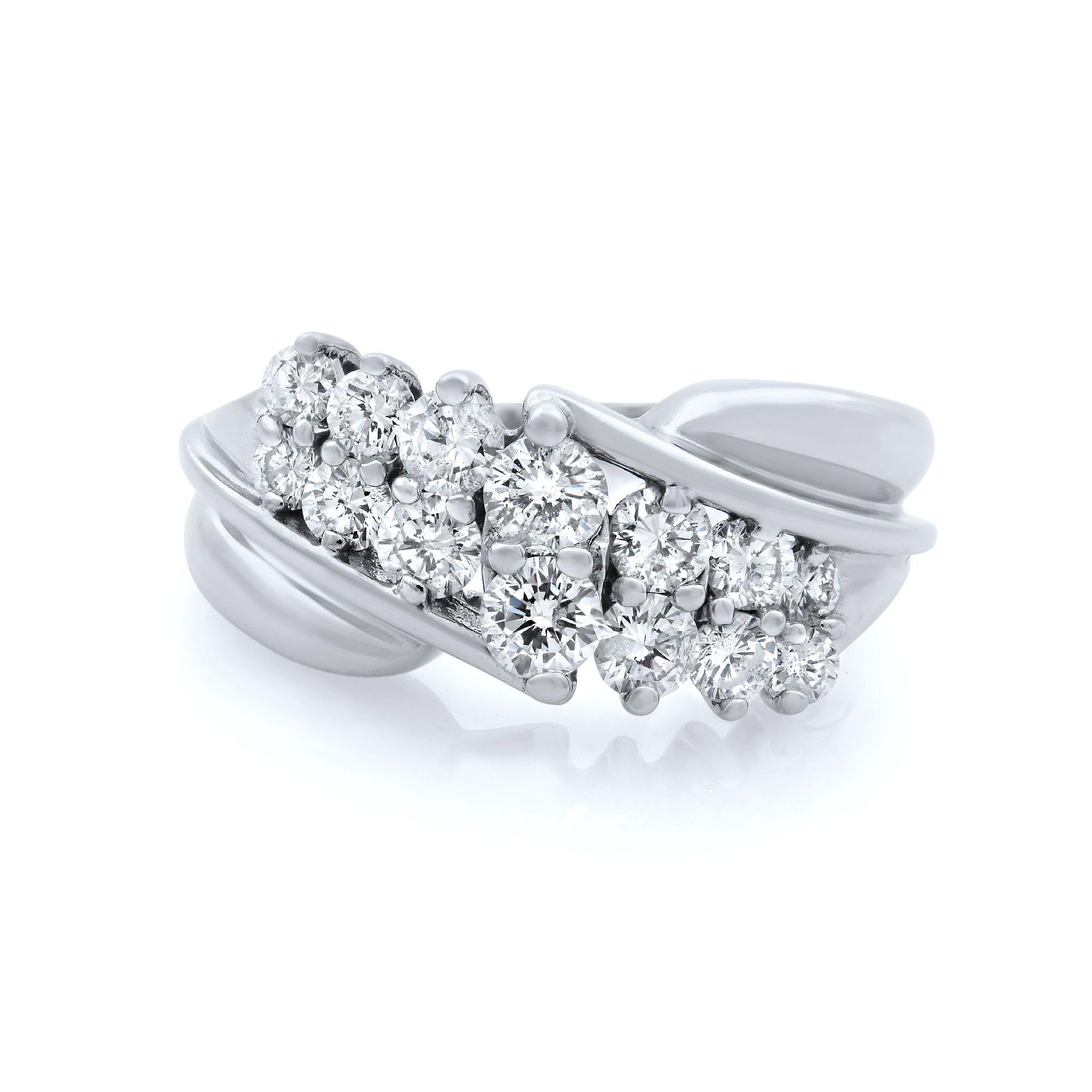 This 14k white gold diamond ring is set with 1.00ct of round cut diamonds. Prong setting. Diamond are VS2 clarity and H color. This piece can be worn as a band or just because ring. Ring Size 5.75. Comes in our presentation box. 