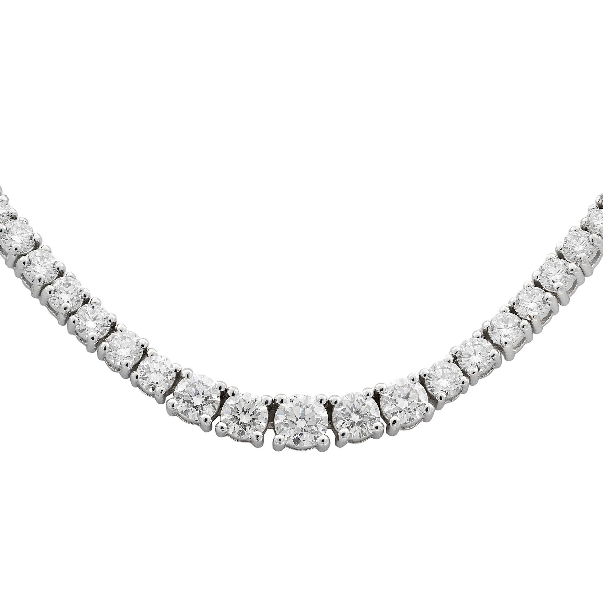The necklace boasts 187 round-cut brilliant diamonds set in 14k white gold.  With a dazzling 7.58 carats total weight. The necklace closes securely with a box clasp. Length: 18 inches. Width: 4.60-2.50 mm.  This is a piece that demands attention and