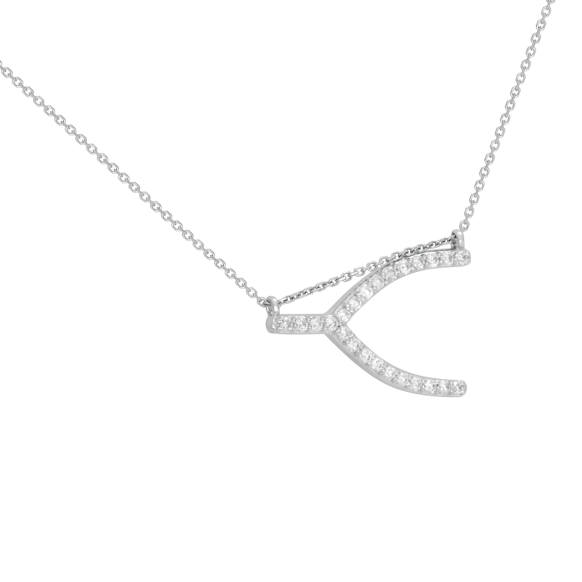 A delicate sideway diamond wishbone necklace crafted in 14k white gold. Set with 0.24 carat of round tiny white diamond. Diamond color G and SI-VS clarity. This necklace symbolizes good fortune and hope. Chain length: 18 inches. Comes with a