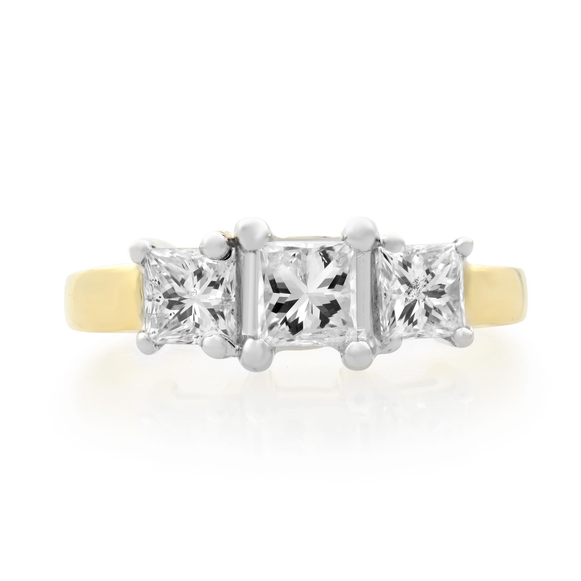 This classic three stone  engagement ring features three princess cut natural diamonds. All diamonds are set in 14k yellow gold. 1.00 carat total diamond weight. Ring Size 7. Diamond Cut: Princess. Color J and SI2 clarity. Weight: 3.60 grams. Comes