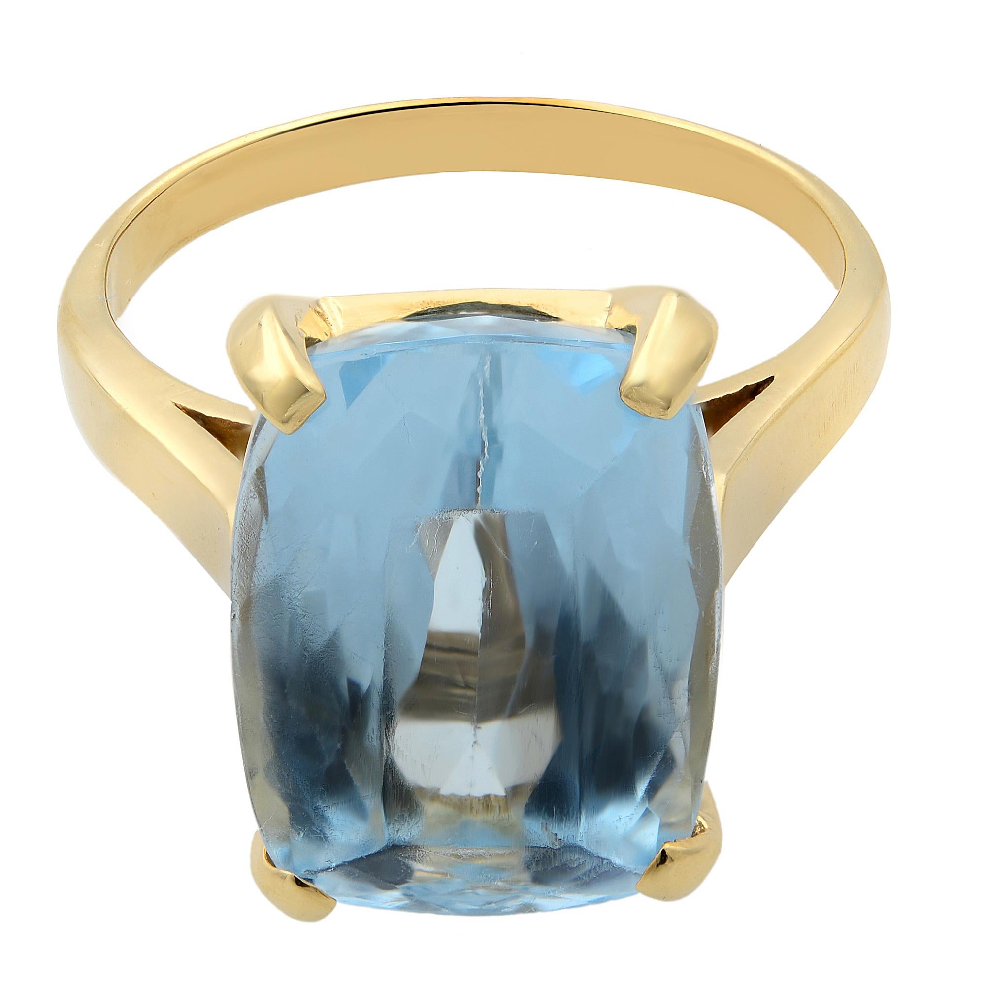 This ring features a large 7.00 carat blue topaz cushion cut gem in a solitaire cathedral prong setting.Crafted in 14k yellow gold. Ring size 8.25. Pre-owned condition. Comes in a delicate jewelry box.  