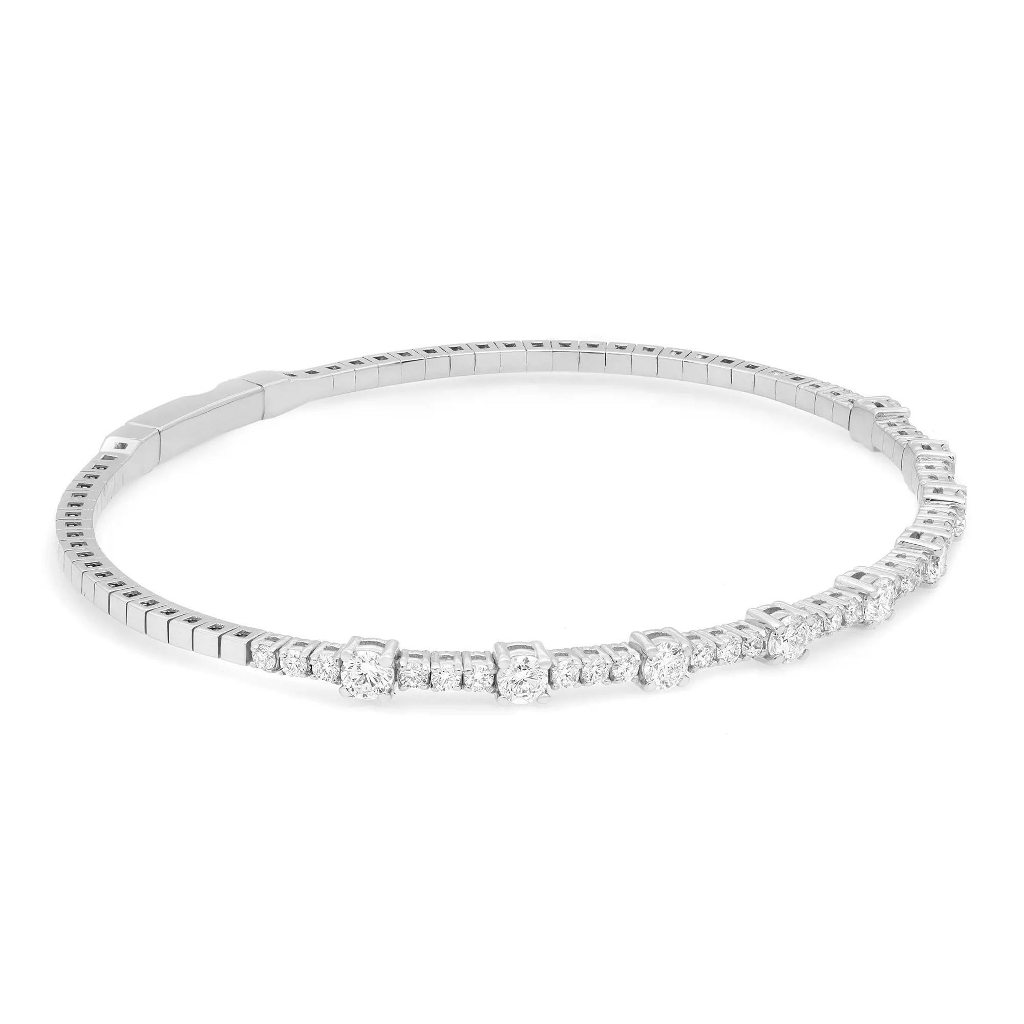 A classic look with easy elegance, this flexible diamond bangle bracelet exudes sophistication. Features prong set round brilliant cut fine white diamonds weighing 1.50 carats, set halfway through the bangle. Crafted in high polished 14K white gold.