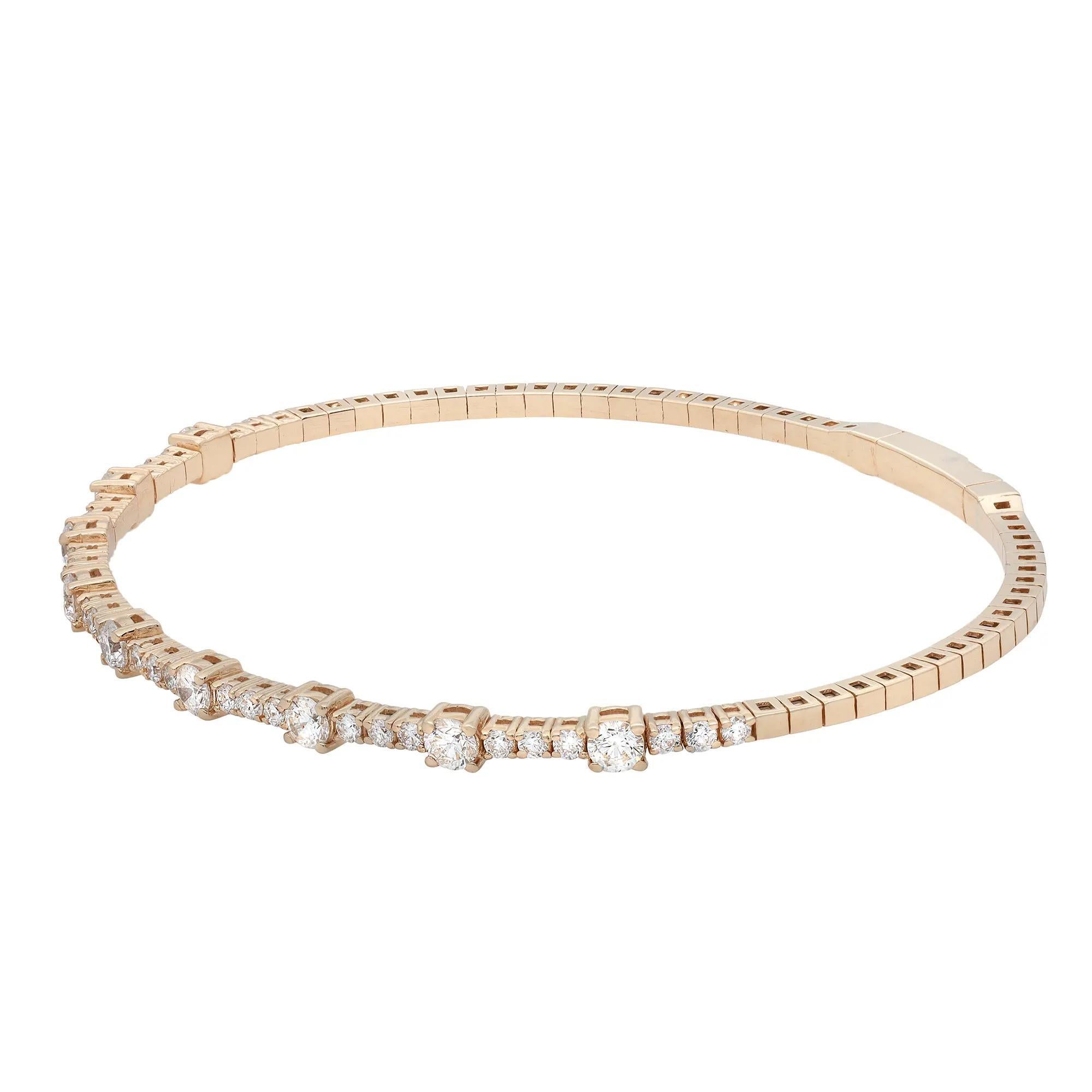 A classic look with easy elegance, this flexible diamond bangle bracelet exudes sophistication. Features prong set round brilliant cut fine white diamonds weighing 1.51 carats, set halfway through the bangle. Crafted in high polished 18K yellow