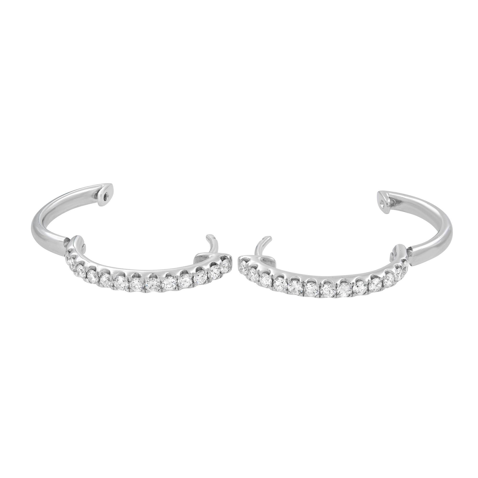 This diamond hoop earring are made with 18K White Gold and feature round cut G VS1 0.29 carat diamonds on each earring. Total carat weight: 0.58. The earrings come with a presentation box.