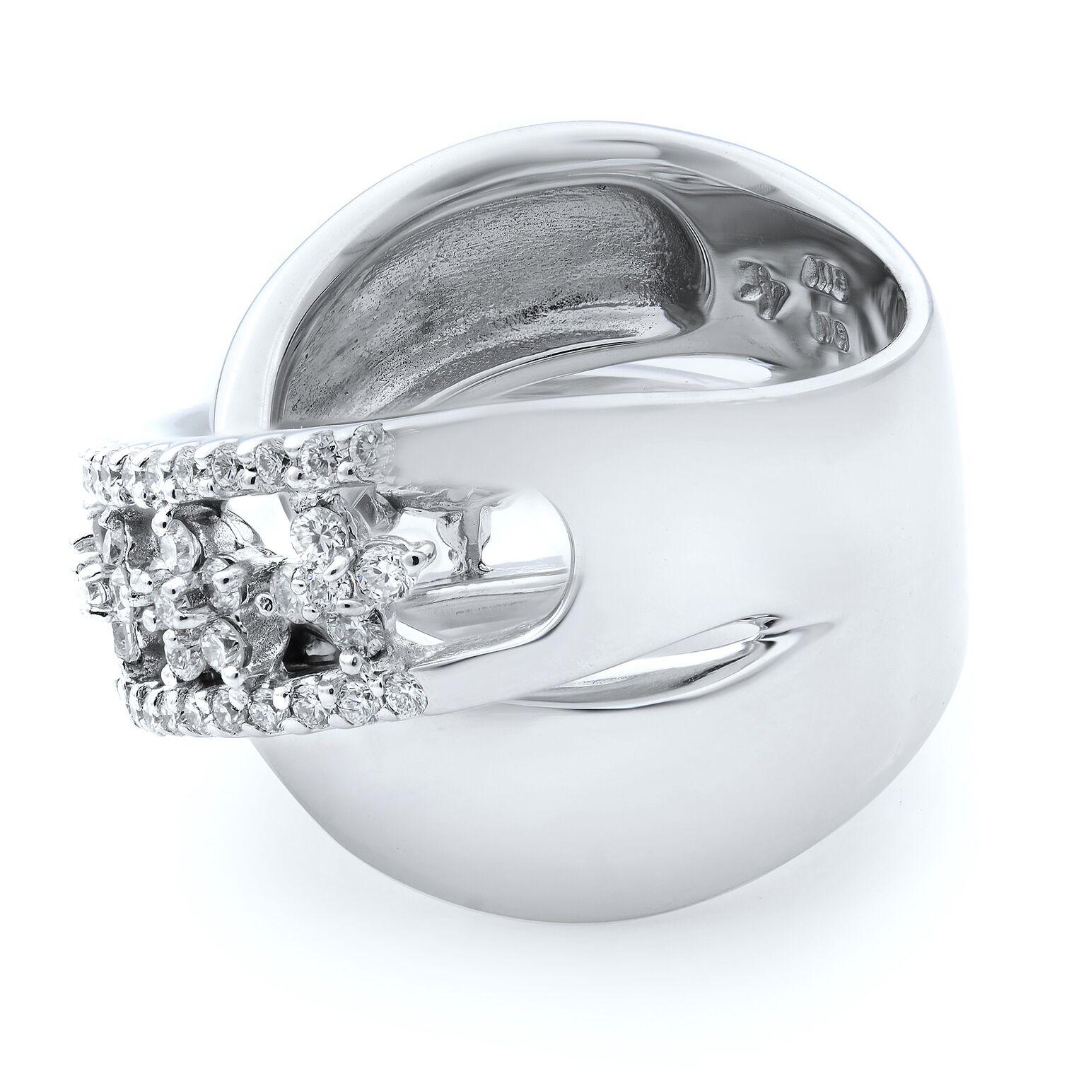 This bold diamond and extremely luxurious thick criss cross ring is crafted in 18k white gold. A huge explosion of brilliance is generated from this stunning diamond band. This band features icy white round cut diamonds weighting 1.00 carat in