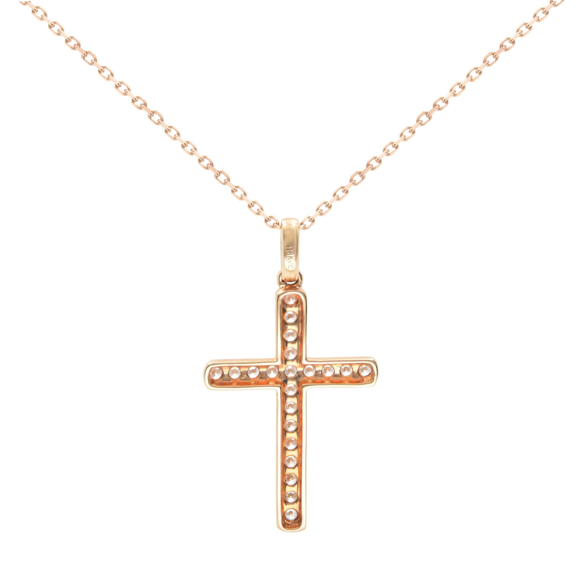 A gorgeous and modern diamond 0.8cttw cross pendant. Includes 20 brilliant round cut diamonds. Diamond color G-H Color and SI Clarity. The diamonds are beautifully set in a unique pave setting. Crafted in 18K Rose Gold. Pendant size:  30x16mm.