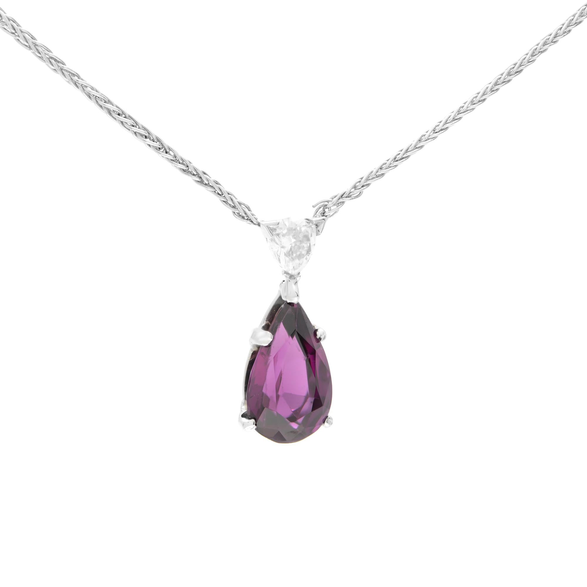 A pear-shaped purple Garnet is secured in a prong setting and embellished with a diamond accent on the top. Simple yet stunning, this teardrop garnet pendant with V bale is sculpted in 18k white gold. Pendant size: 20.00mm. Chain length: 18 inches.