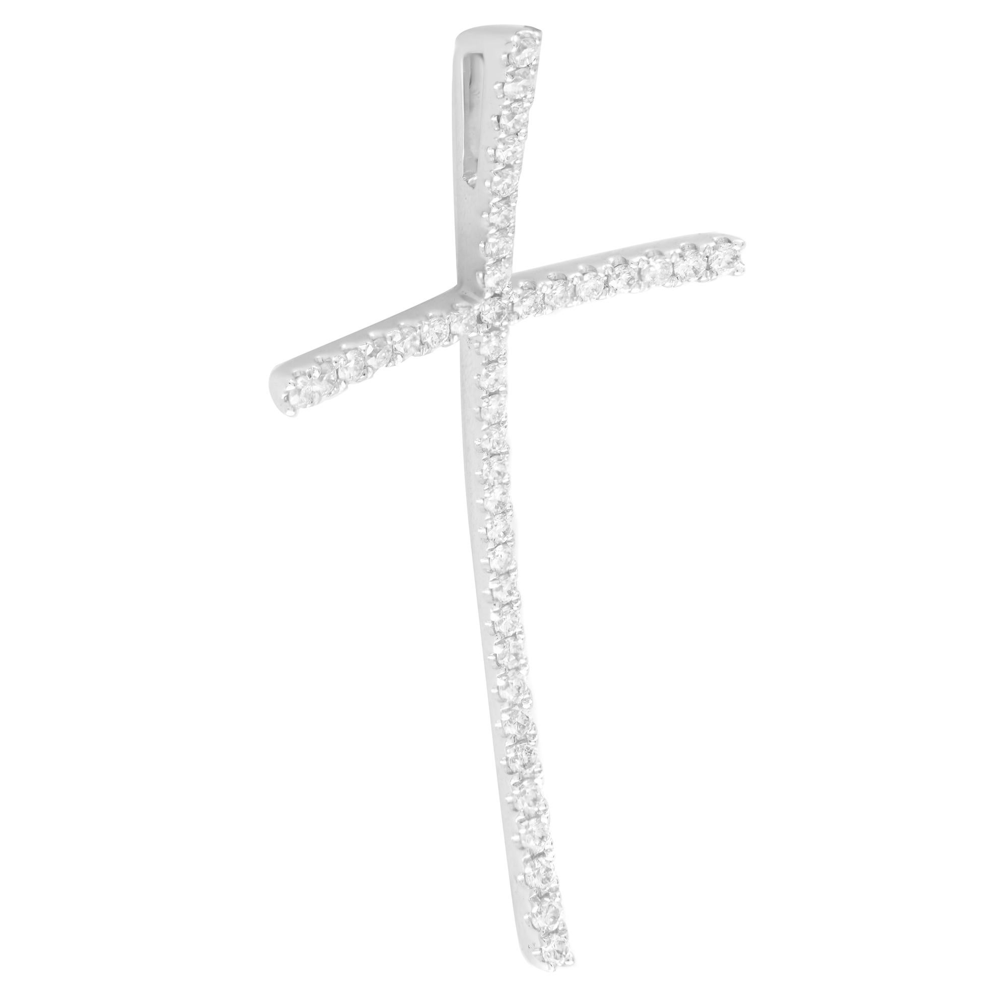A unique style curved diamond cross pendant. Crafted in 18k white gold and pave set with tiny round cut diamonds. Total carat weight: 0.42. Diamond color I and SI-I clarity. Cross measurements: 38x20mm. Chain is no included. Comes with a presentable