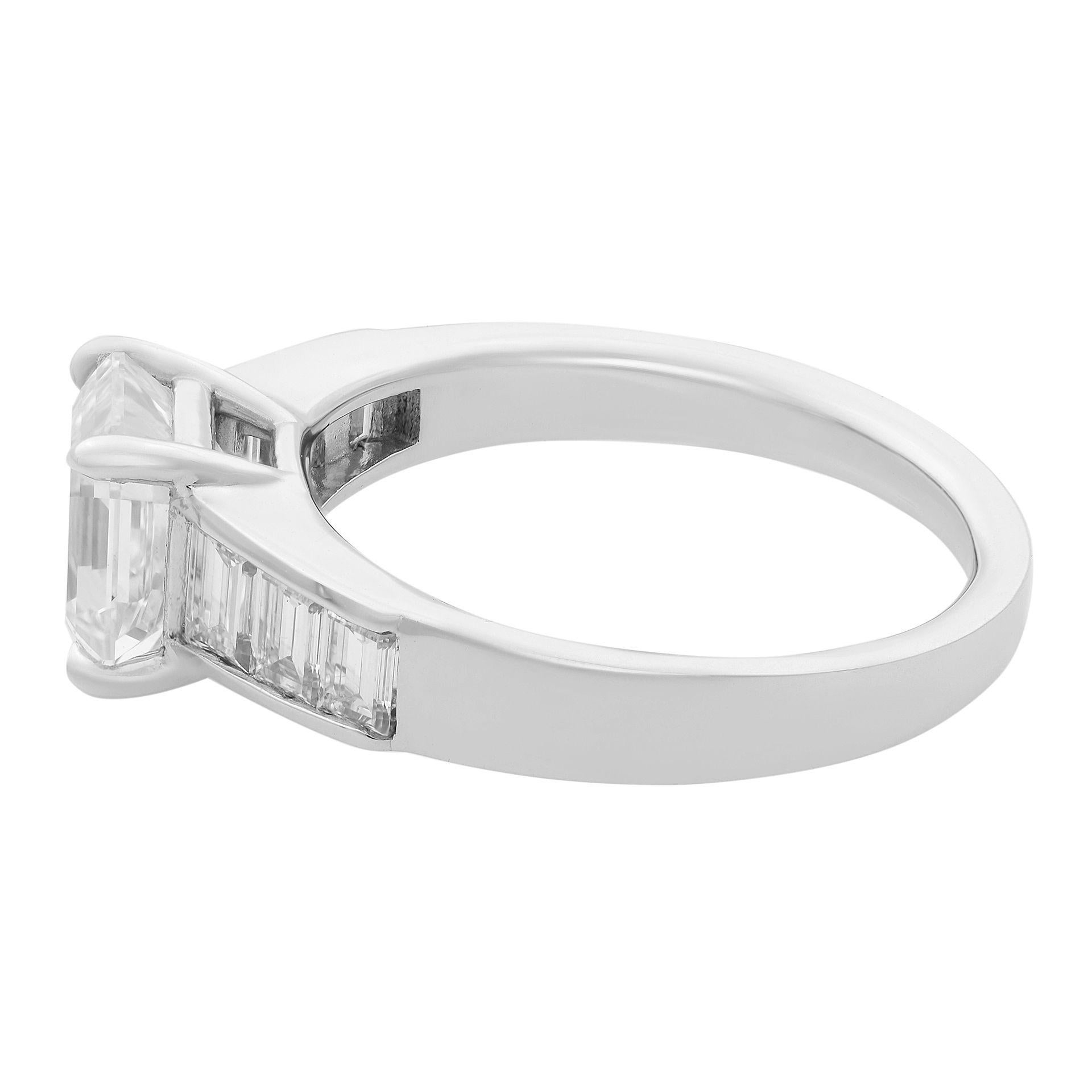 This modern and stylish engagement ring features square emerald cut center stone tapered emerald and baguettes channel set shank. Center stone weights 2.21 carat. Total carat weight 2.86. GIA certified. Diamond color grade J and VVS2 clarity grade.