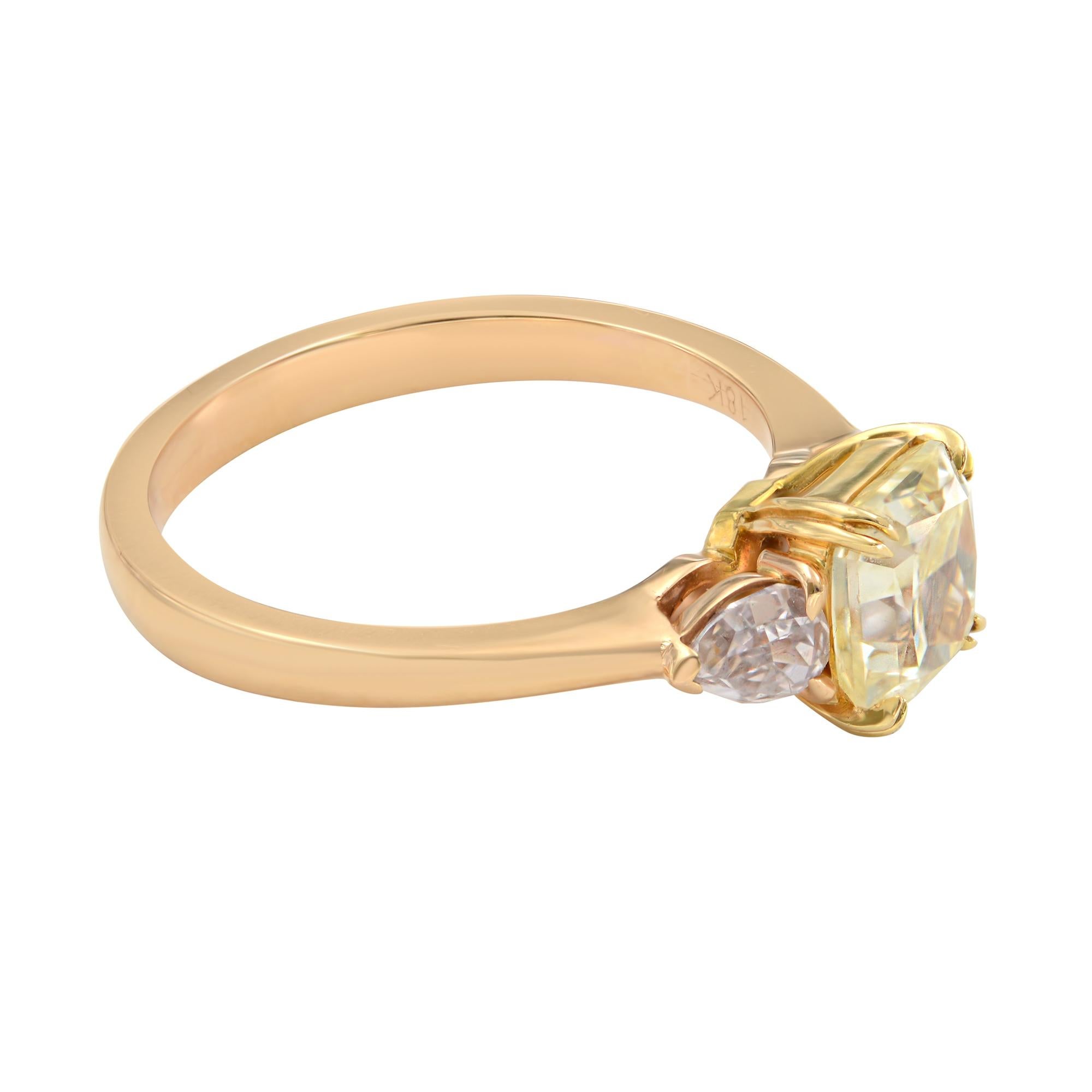 A beautiful, unique fancy yellow and pink diamond three-stone engagement ring. Crafted in 18K yellow gold. Fancy yellow weight, 1.37cts. Pink diamond weight, 0.36cts. Ring size 6.5. The ring comes with 3 GIA certificates. 
