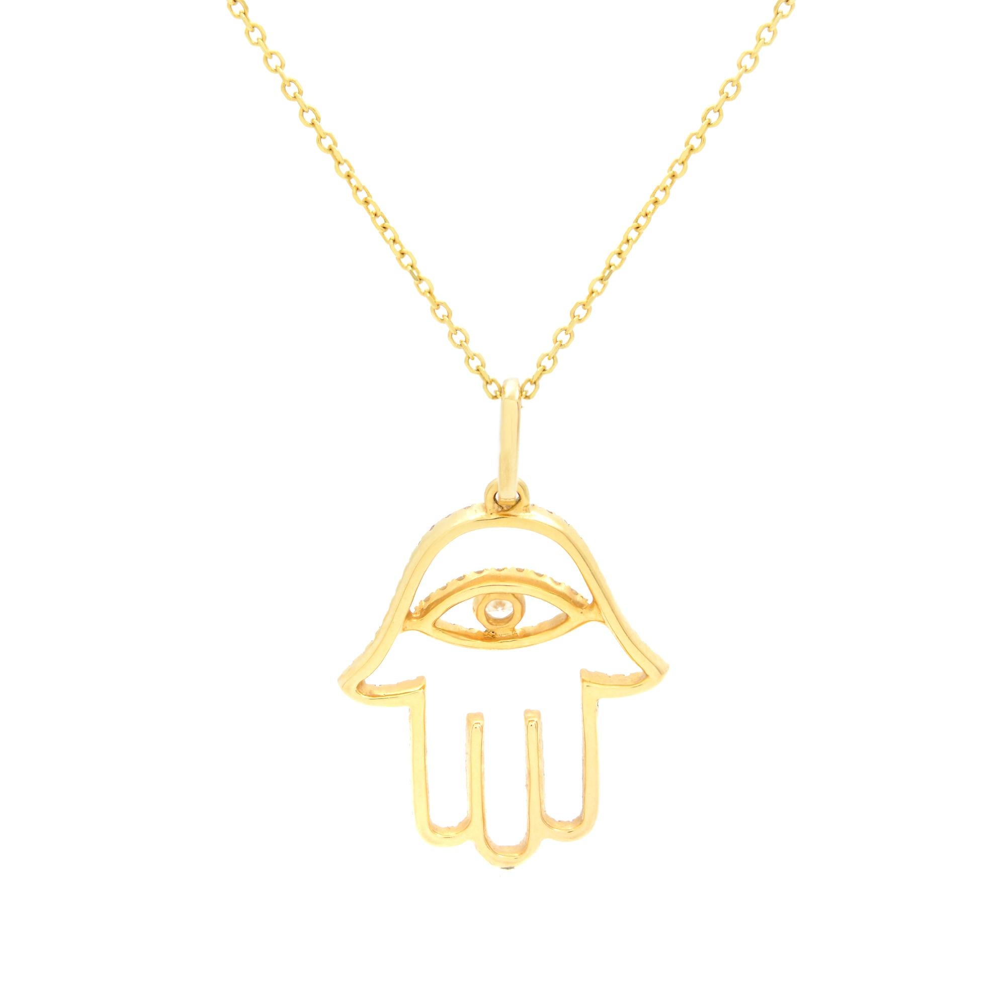 This majestic Hamsa pendant features 0.30cttw brilliant round white diamonds in micro pave setting. At the center evil eye symbol bezel set with a tiny diamond. Crafted in 18K yellow gold. Diamond color G-H and VS-SI clarity. Pendant size: 25x16mm.