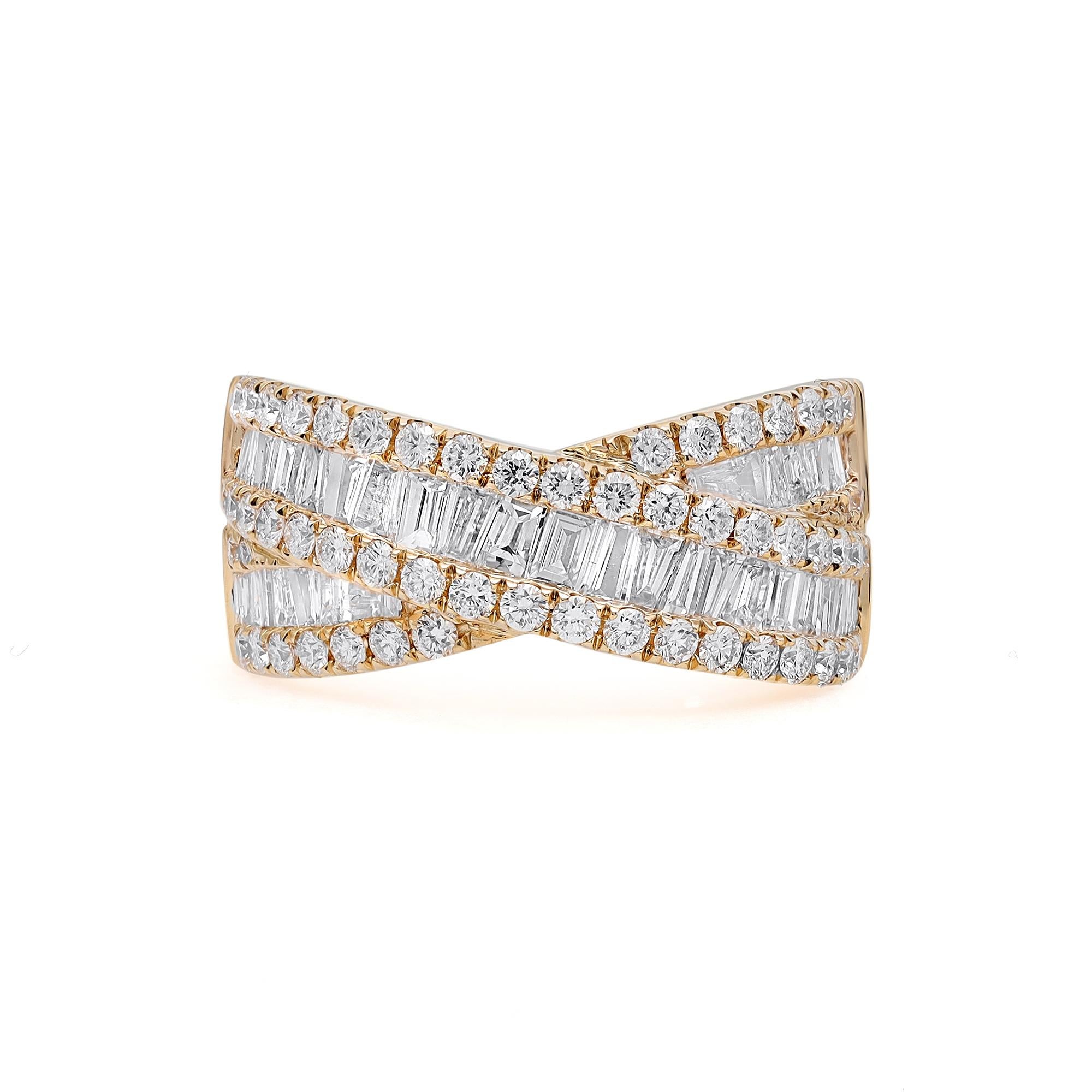 Simple yet dramatic, this crisscross diamond band ring makes a perfect statement look. Crafted in 18K yellow gold. It features a total of 91 diamonds comprising of channel set baguette cut and prong set round brilliant cut diamonds. Total diamond