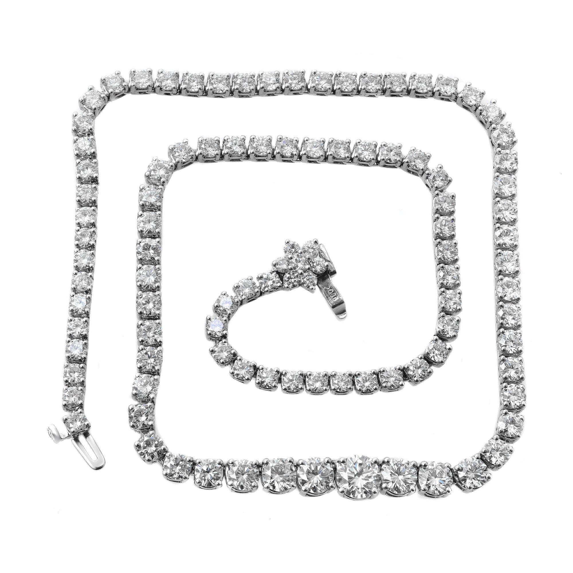 This Tennis necklace boasts 102 round-cut brilliant diamonds set in platinum 950. Features a push button clasp secured with addition safety hinged clasp. Total carat weight, approximately 20.00ct. Diamond color I and VS-SI clarity. Weight: 40.00 g.