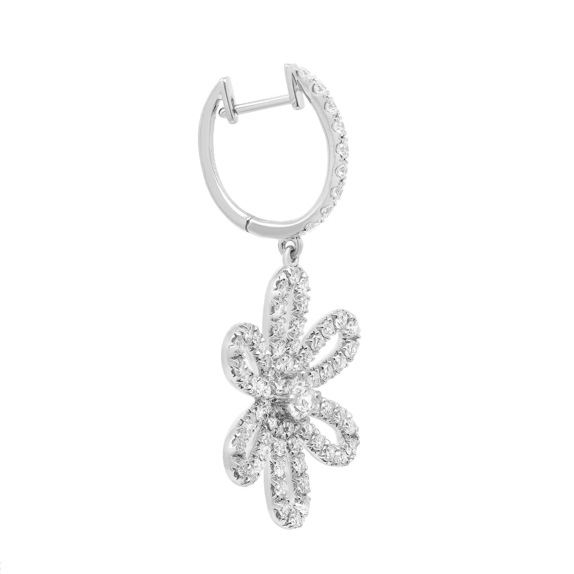 Diamonds in full bloom. These stunning diamond flower drop earrings are crafted in 18k white gold. Showcasing prong set round brilliant cut diamonds weighing 2.50 carats. Diamond quality: color G-H and clarity VS-SI. Earring length: 1.5 inches.