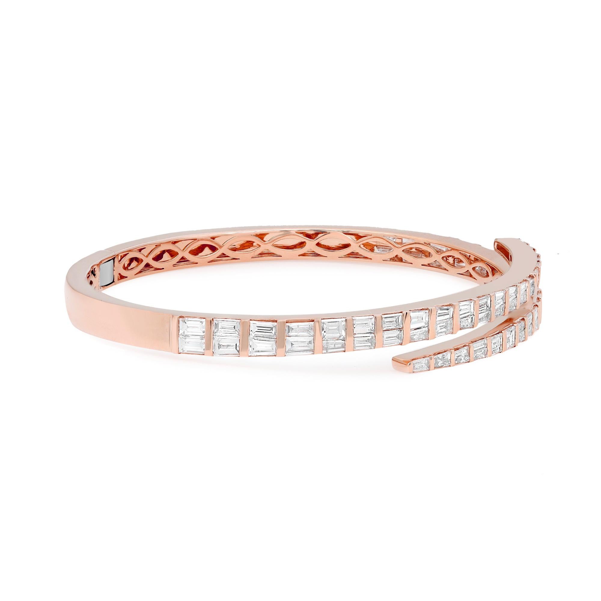 Let your style shine with this fancy and elegant diamond bangle bracelet. Crafted in 18k rose gold. This stunning bracelet features 78 channel set tapered Baguette cut shimmering diamonds with a total weight of 4.36 carats. Diamond color G-H and