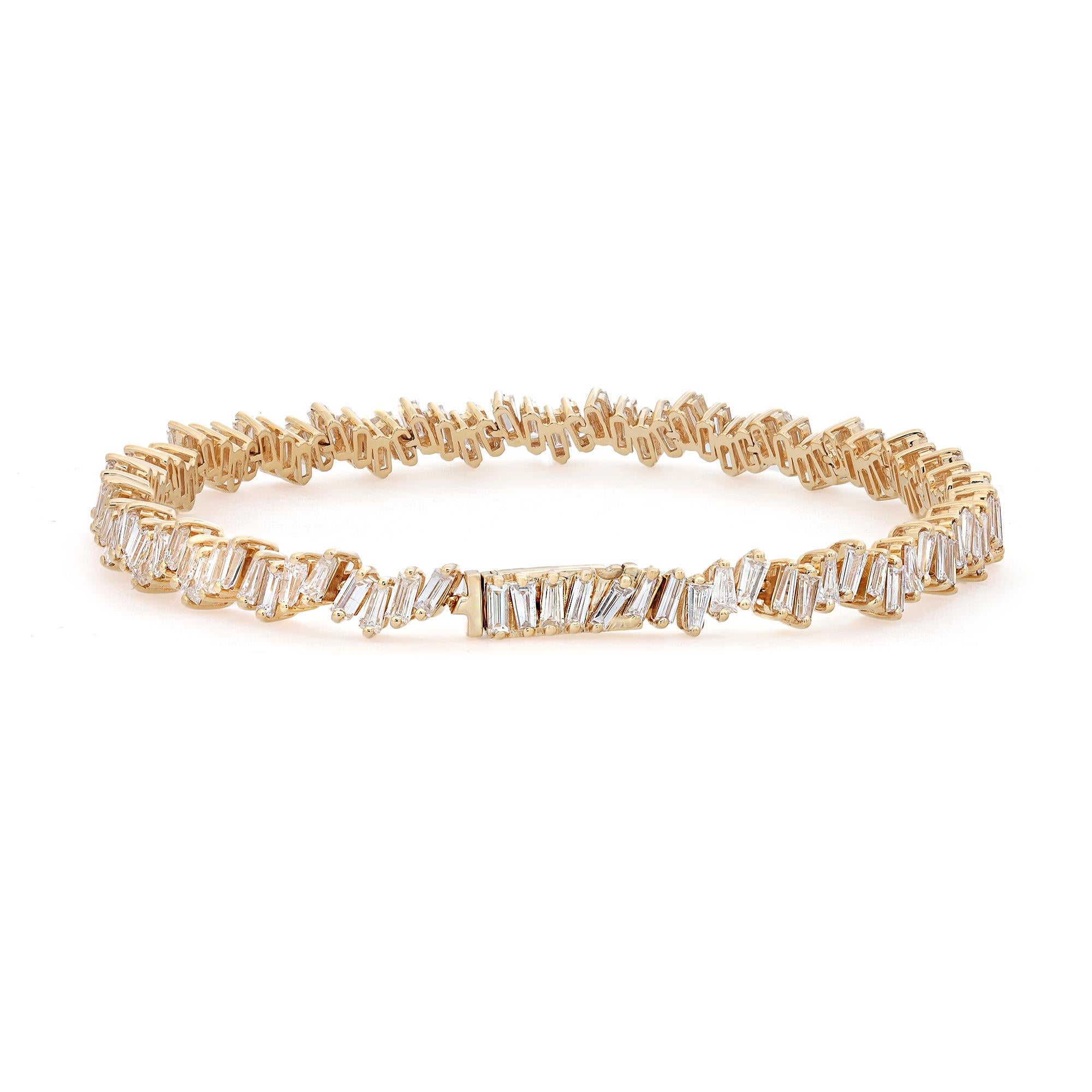 A classic look with easy elegance, this diamond bracelet exudes sophistication. Crafted in 18k yellow gold. This tennis bracelet features baguette cut diamonds encrusted in a zig-zag pattern in prong setting with a total diamond weight of 4.48