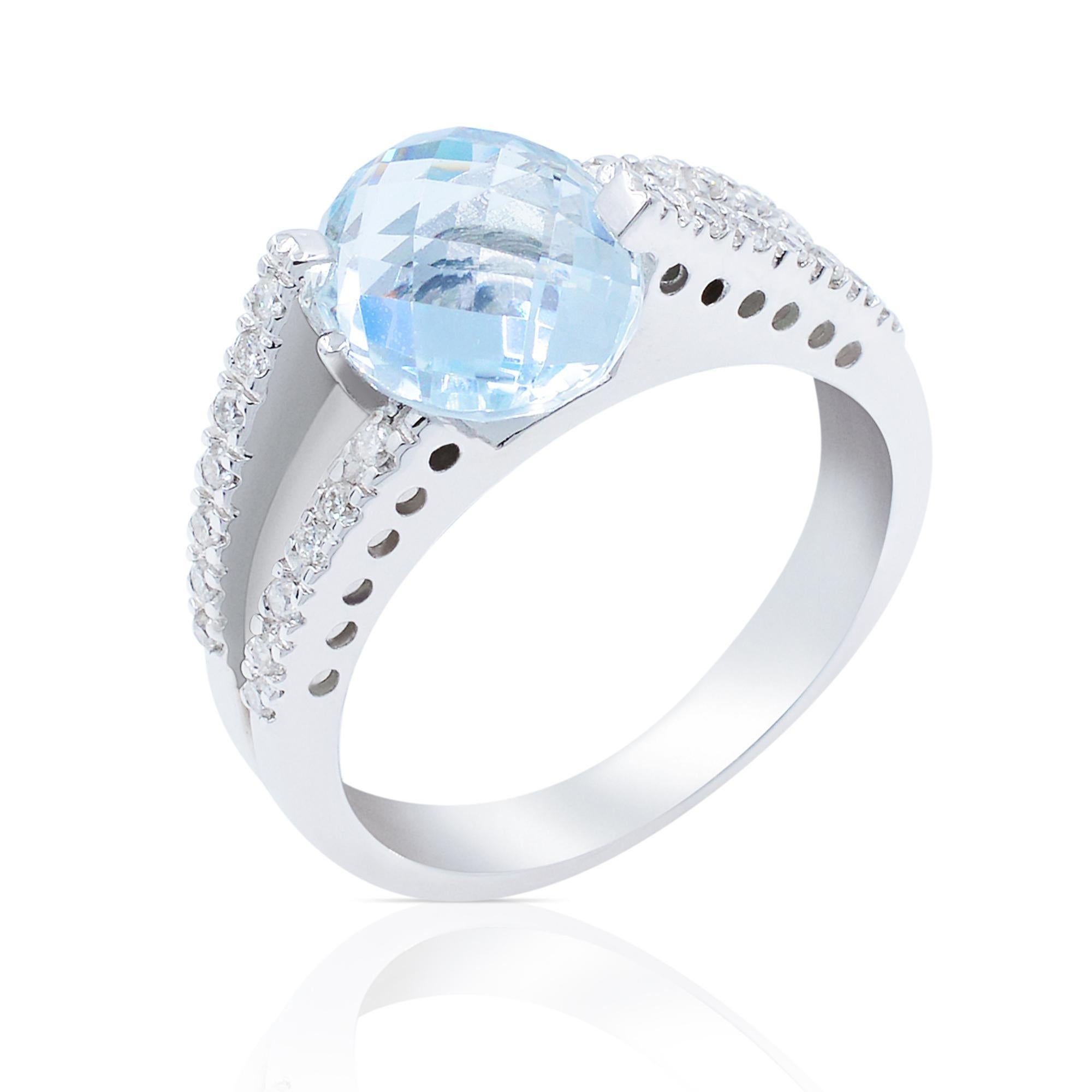 Elegant checkerboard aquamarine ladies ring featuring an oval cut aquamarine as center stone along with the two slips setting with a total of 27 diamonds weighing 0.21 cttw. Diamond quality: G color and VVS clarity. Crafted in high polished 18K