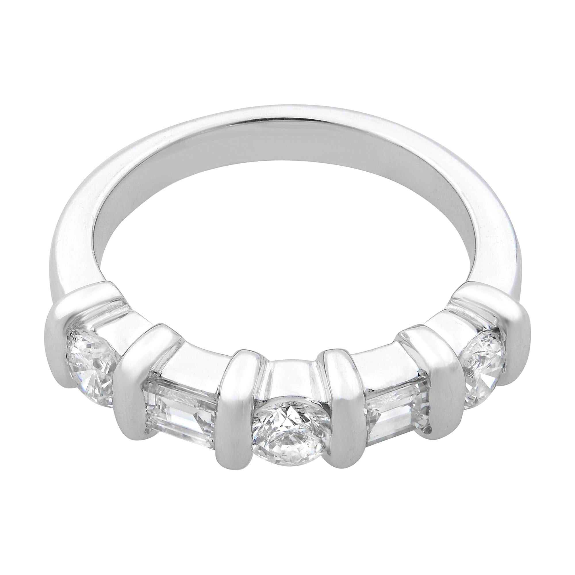 This beautiful diamond wedding band features 3 brilliant round cut and 2 baguette cut diamonds weighing 0.66ct, coupled with smooth, lustrous vertical rounded channels. Diamond color G and SI1 clarity. This band is crafted in 14k white gold. The