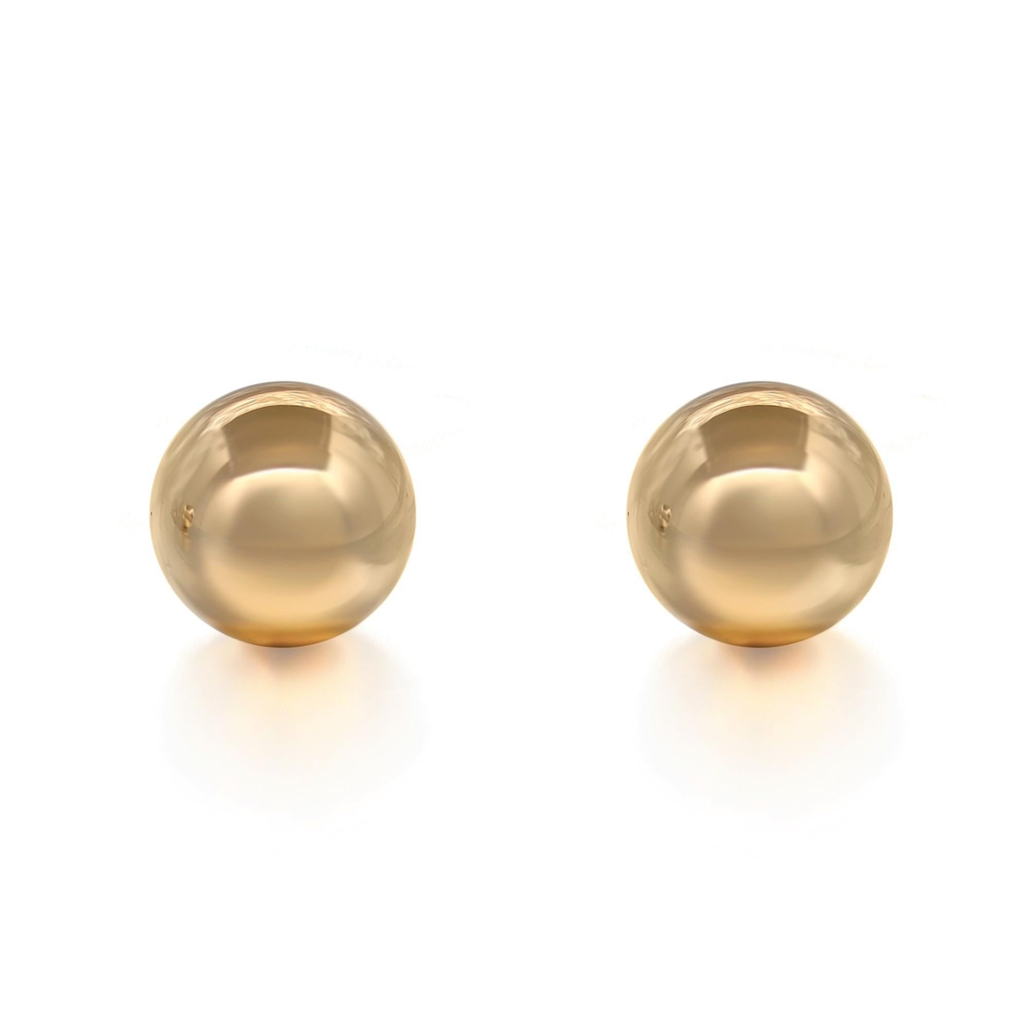 Simple and classic round ball bead shape stud earrings. These earrings are crafted in highly polished hollow 14k yellow gold for a lightweight, wearable feel. Ideal for every day wear. Secured with push back post closure. Size: 9mm. Total weight: