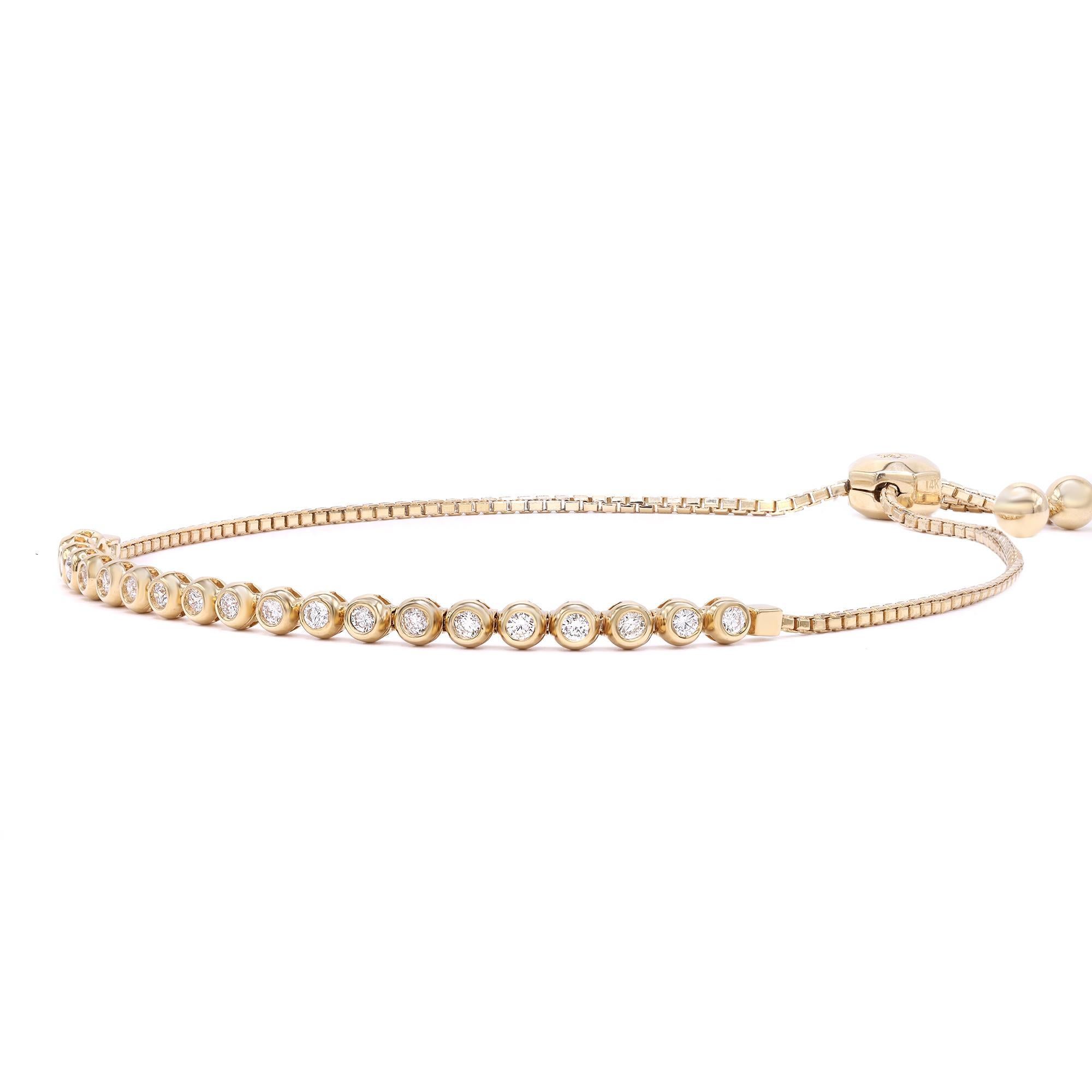 Trendy tennis bracelet with a sliding lariat closure on a delicate box chain. Super comfortable, so easy to wear! The design is shimmered with 22 bezel set round brilliant cut diamonds totaling 0.67 carats crafted in fine 14K Yellow Gold. Good