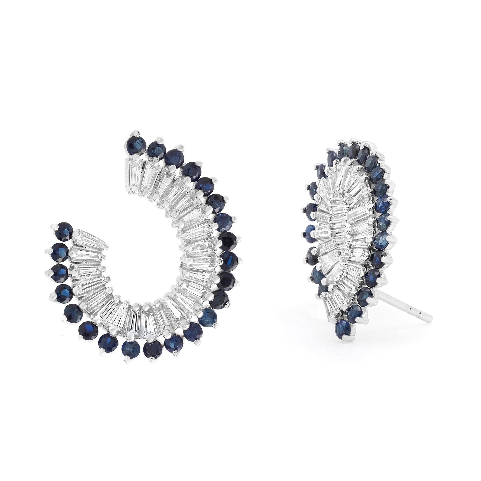 Elevate any attire with these dazzling earrings which is crafted in fine 14K white gold. These earrings feature prong set Baguette cut diamonds weighing 1.68 carats with round cut Blue Sapphires weighing 1.91 carats. Diamond quality: color G-H and