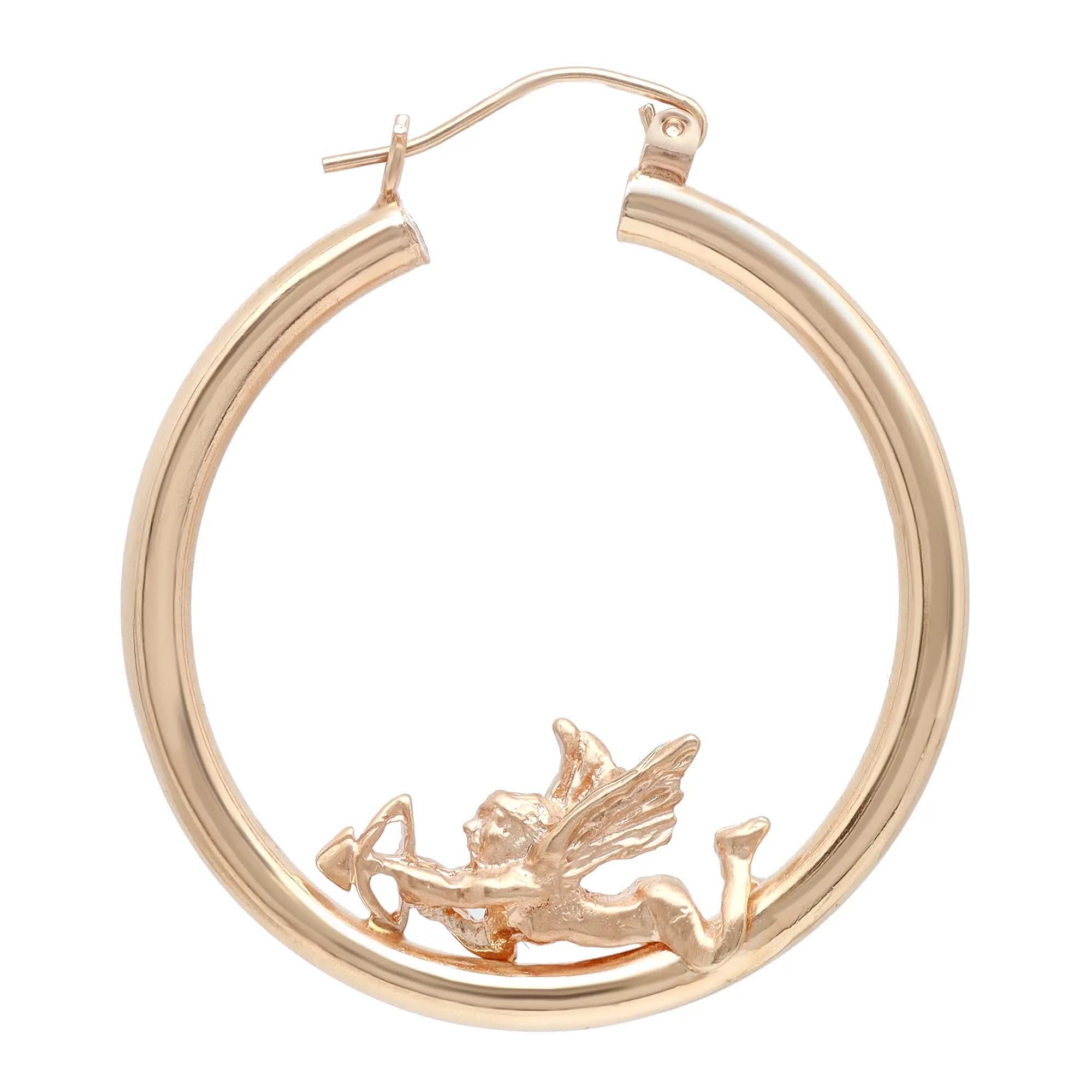 These chic and trendy round hollow hoop earrings showcase stunning 3D angel cupid motifs. Crafted in 14k yellow gold, it features a majestic glow of high polish finish. This pair of hoop earrings will make a perfect eye catching fashion statement.