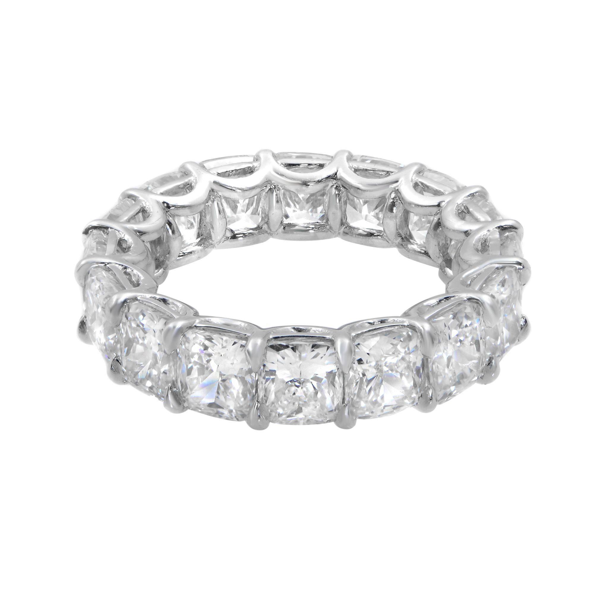 This beautiful eternity band ring is set with 16 perfectly matched cushion cut diamonds, each weighing between 0.70 carat. Each stone is G-H color and SI clarity. The total carat weight is 9.99. This band is crafted in platinum with ring size 5.5