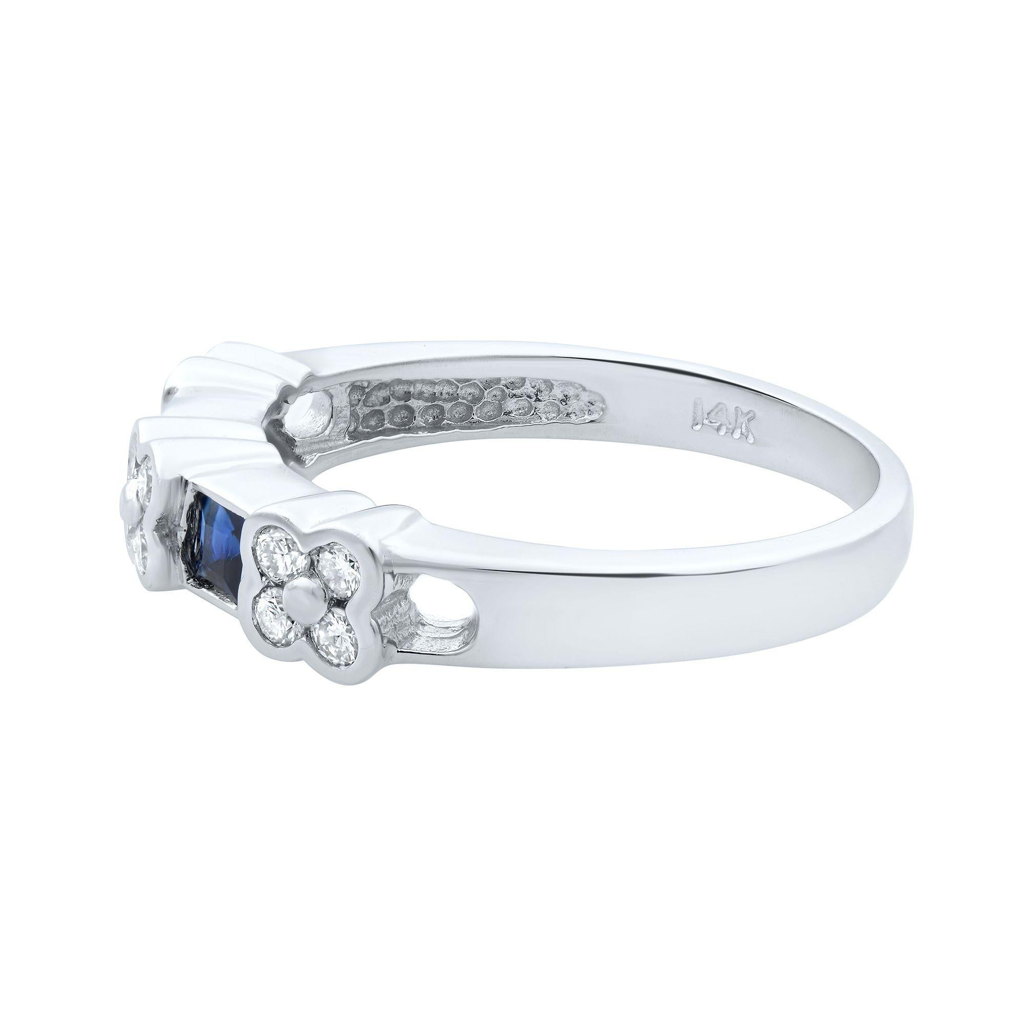 This stunning diamond half eternity band beautifully displays small round cut diamonds with princess cut shaped blue sapphires. Total diamond weight: 0.20ct. Total blue sapphire weight: 0.24ct. The width of the ring is 4.00mm. Total weight: 2.80
