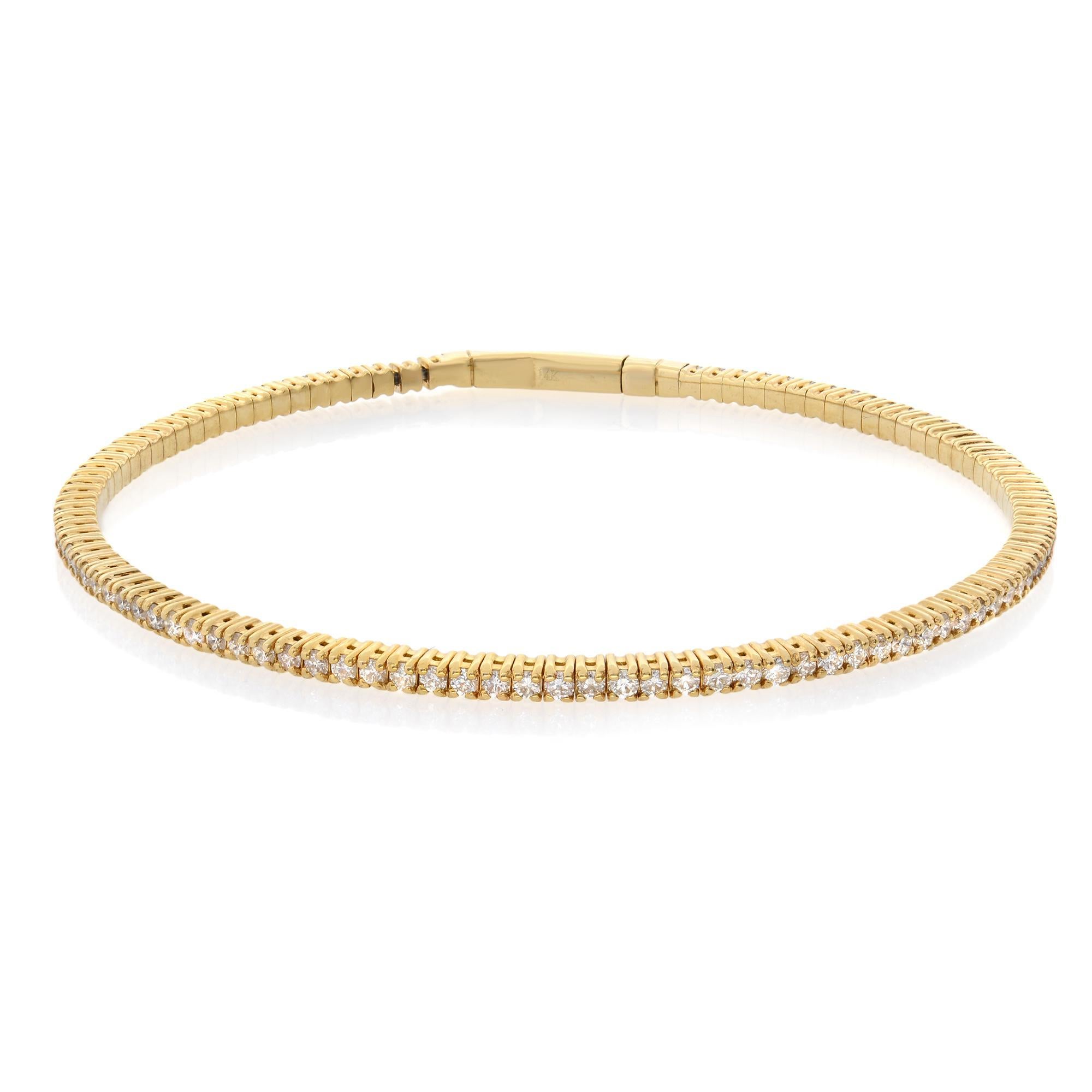 A classic look with easy elegance, this diamond bangle exudes sophistication. One stunning flexible bangle bracelet in 14K yellow gold, prong-set with fine white diamonds with a total weight of 1.50cts. The bangle measures 1.8mm in width and weighs