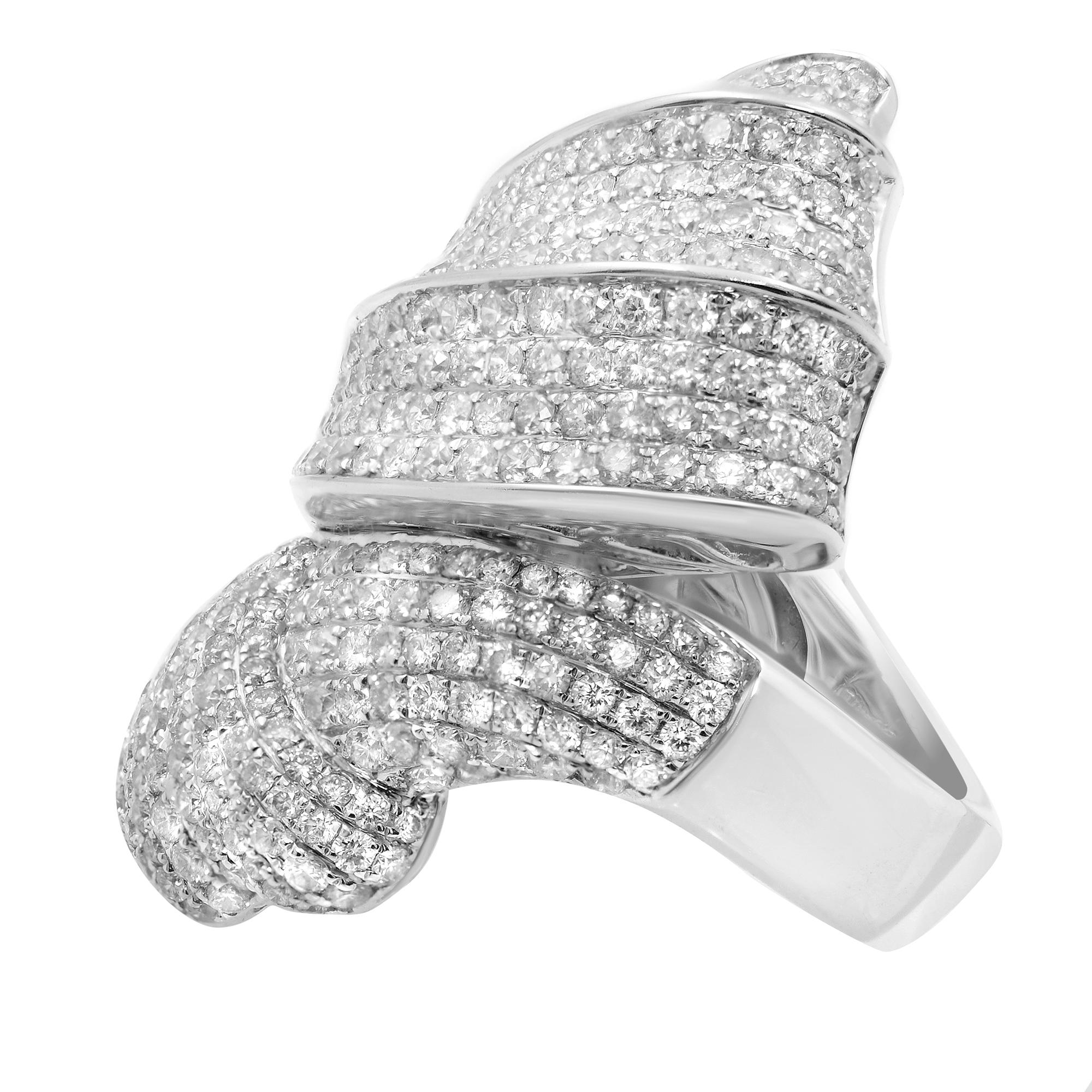 This beautiful diamond cocktail ring is set with rows of numerous round diamonds. Total diamond carat weight is approximately 4.50 with G color and VS clarity. Crafted in 18k white gold. Ring size is 7. The top measurement is 39mm. Weight: 21.70