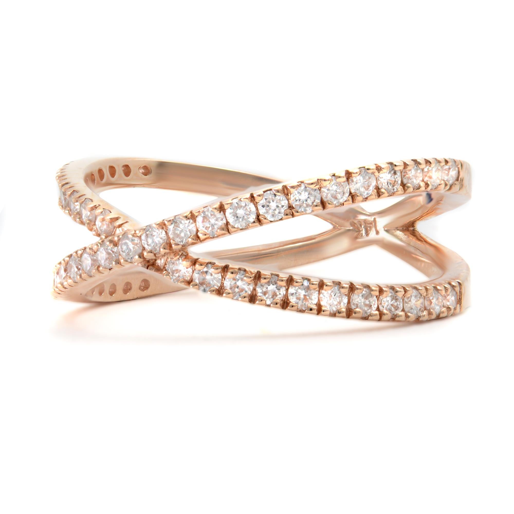 Two bands of brilliant pave set round diamonds intersect each other in a criss-cross design. Crafted in 14k rose gold, this ring exudes understated style and elegance. Set with 0.54 carat in total. Diamond color G and SI-VS clarity. Ring size 7.25.