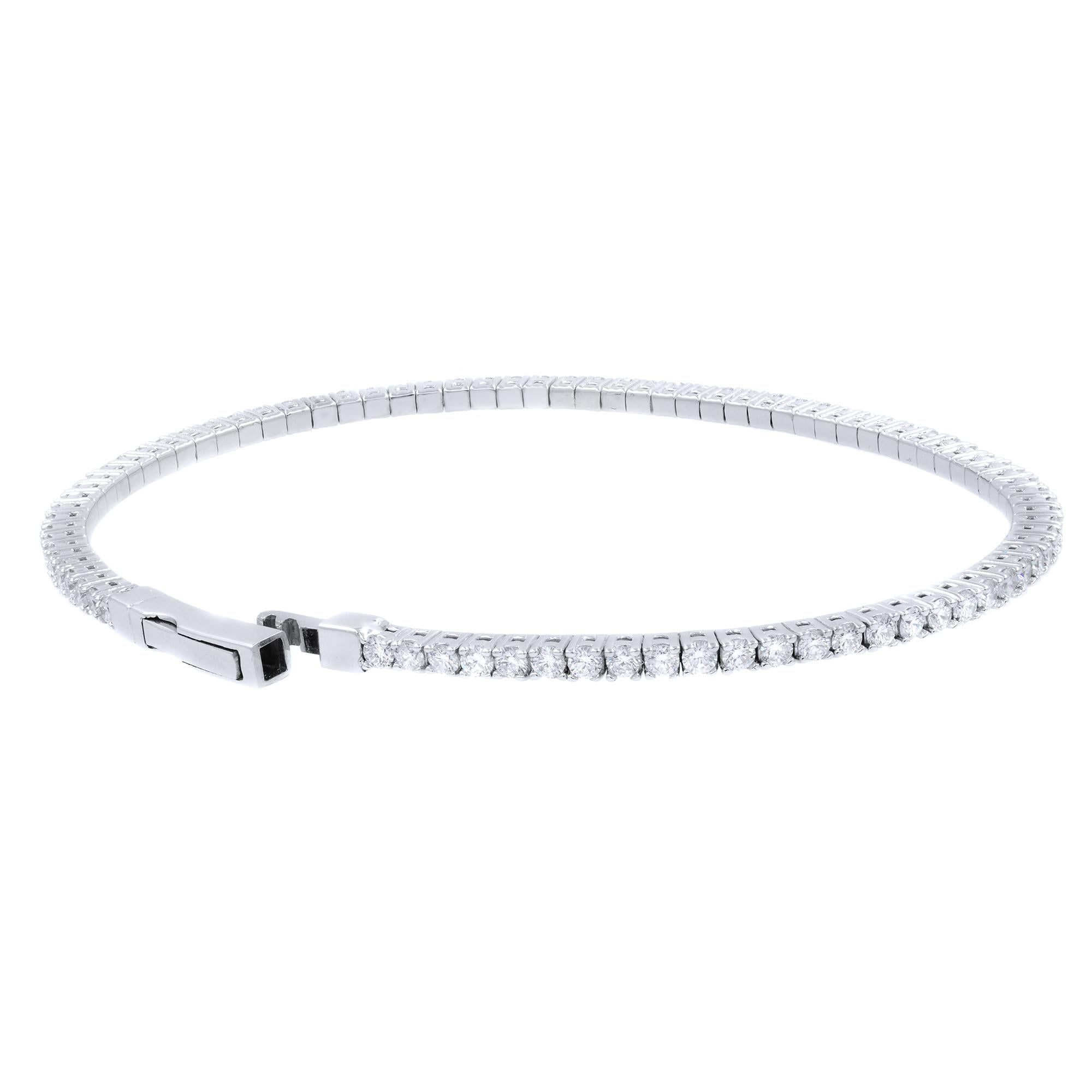 A classic look with easy elegance, this diamond bangle exudes sophistication. One stunning flexible bangle bracelet in 14K white gold, prong-set with fine white diamonds with a total weight of 2.00cts. The bangle measures 2.1mm in width and weighs 7