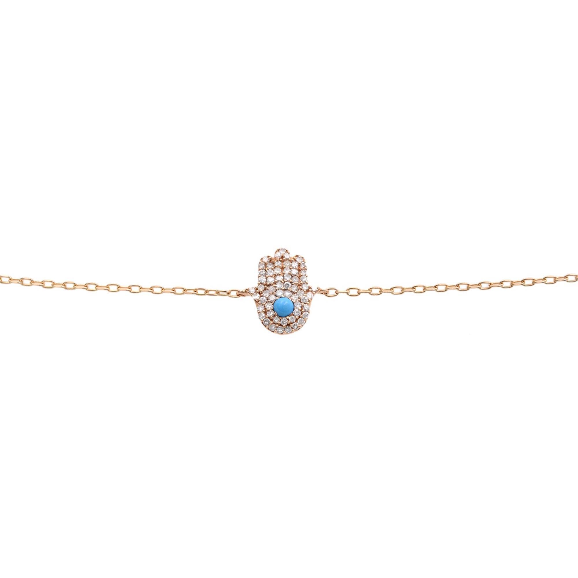 Classic and timeless hamsa bracelet, crafted in 14k rose gold comes with center stone turquoise surrounded by round cut pave set white diamonds weighing 0.15cttw, anchored with delicate 7.5 inches 14k rose gold chain. This bracelet is available in