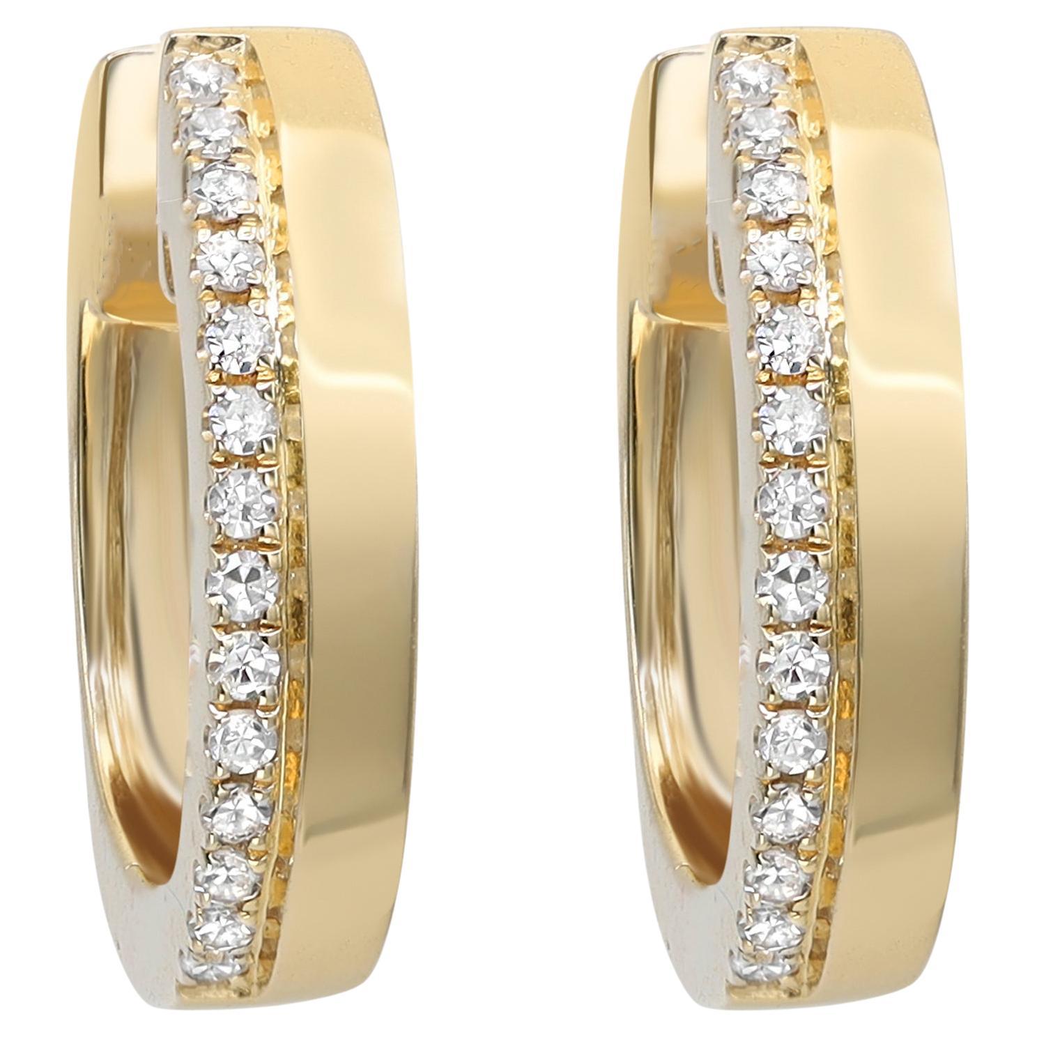 Dainty and classic diamond huggie earrings, perfect for a great everyday look. These earrings are crafted in fine high polished 14K yellow gold and encrusted with round cut diamonds weighing 0.08 carat. Diamond color G-H and clarity VS-SI. Earring