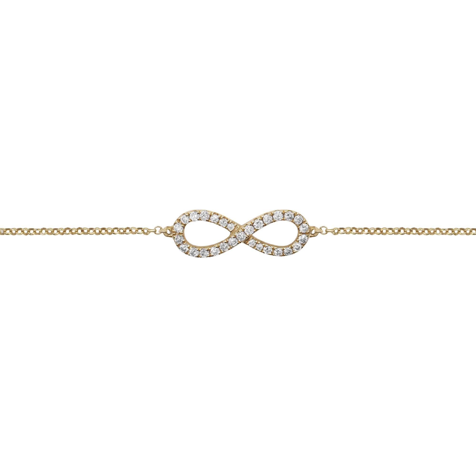 A gorgeous simple diamond bracelet, an Infinity style set with clean and sparkly diamonds. Total carat weight: 0.25. Diamond color G-H and SI1 clarity. 
Made with 14K Yellow Gold. Bracelet length: 7.25. Comes with a presentable gift box and