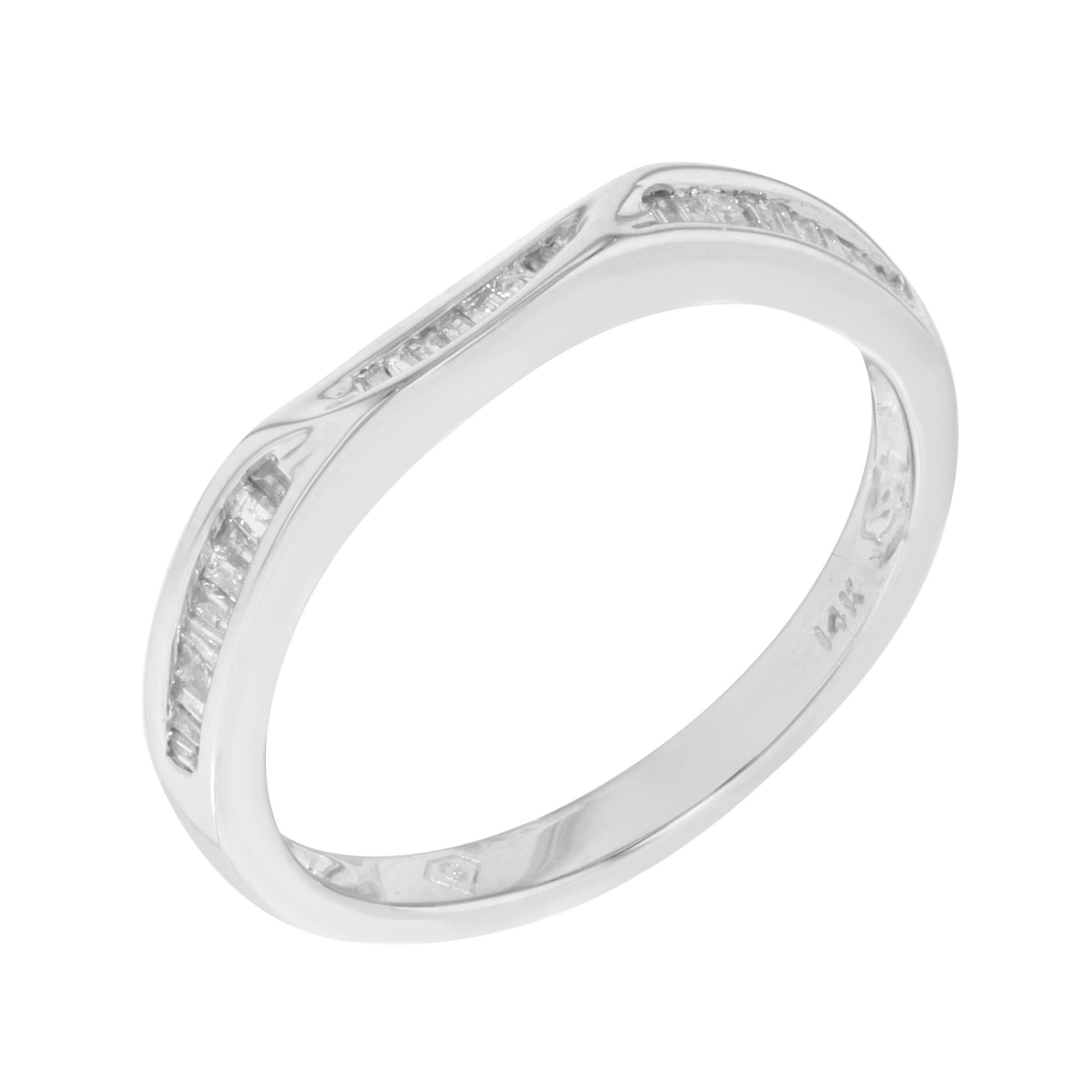 This beautiful petite band features white baguette diamonds lined up to create a faceted passageway that glimmers as it bends around the finger. Crafted in high polished 14k white gold and encrusted with appx. 0.22cttw of diamonds. The size of the