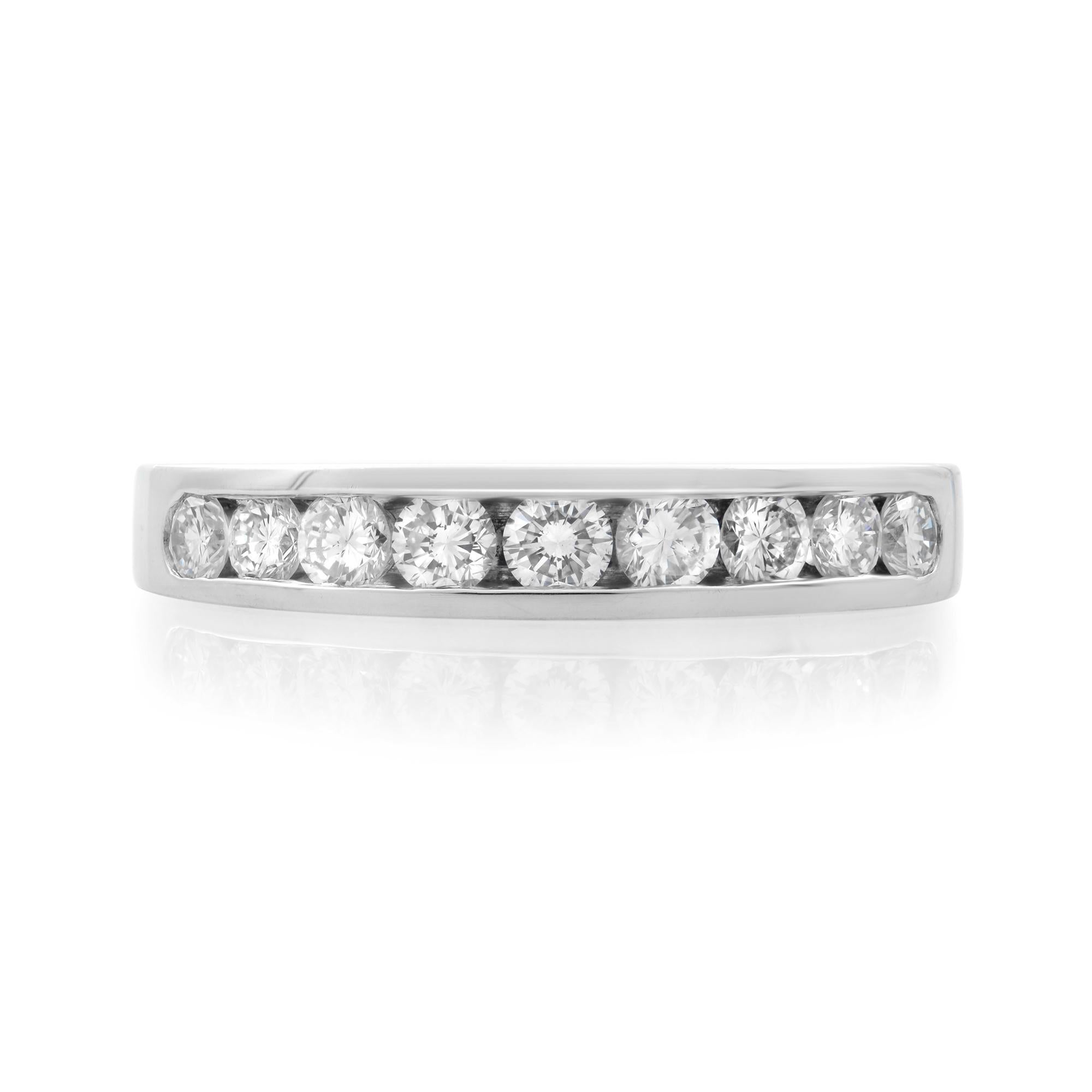 This classic women's ring band features 9 round brilliant cut natural diamonds. All diamonds are channel set in a solid platinum setting. Total carat weight: 0.50. Diamond color G and SI1 clarity. Band width: 3.50-2.50mm. Ring Size 7. Comes with a