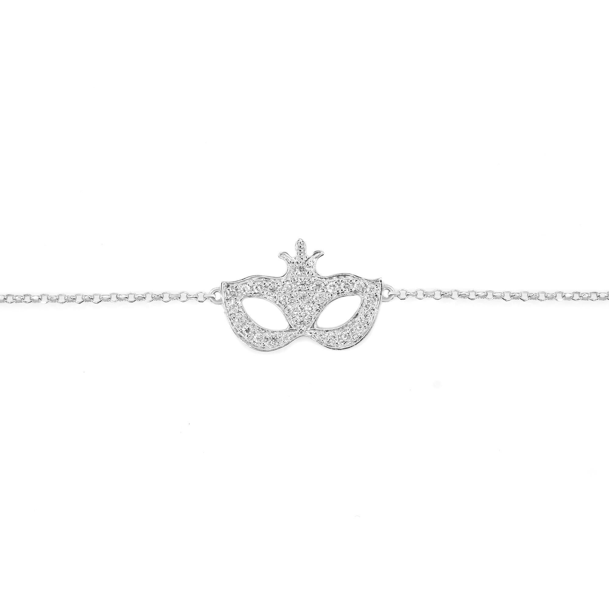 A small masquerade mask simple diamond chain bracelet. Crafted in 18k white gold. Set with 0.23cttw of tiny round cut diamonds. Diamond color I and SI-I clarity. Bracelet length: 7 inches. Comes with a presentable gift box and appraisal.