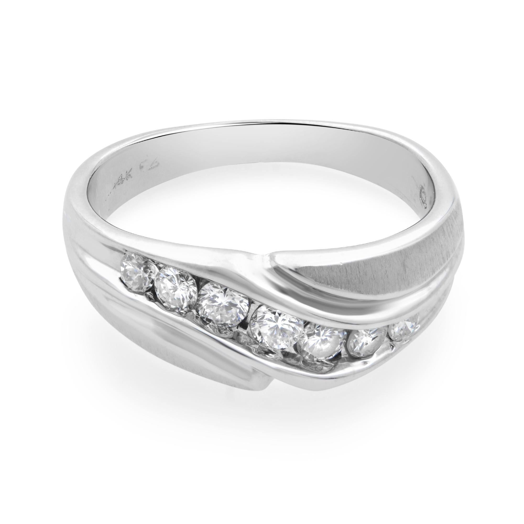 This diamond men's ring is crafted in 14k white gold. The ring features 7 channel set round cut diamonds weighing 0.50ct. Ring size: 9. Total weight: 7 gms. Comes with the manufacturer's box and booklet.