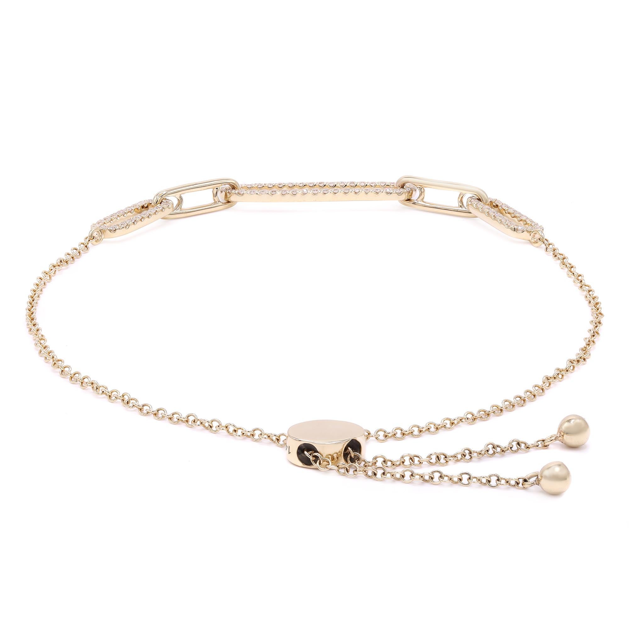 Beautiful and sleek, this diamond paper clip link bracelet is stackable and easy to wear with adjustable bolo closure. It features pave set round cut diamonds set in alternating paper clip links, crafted in high polish 14k yellow gold. The total