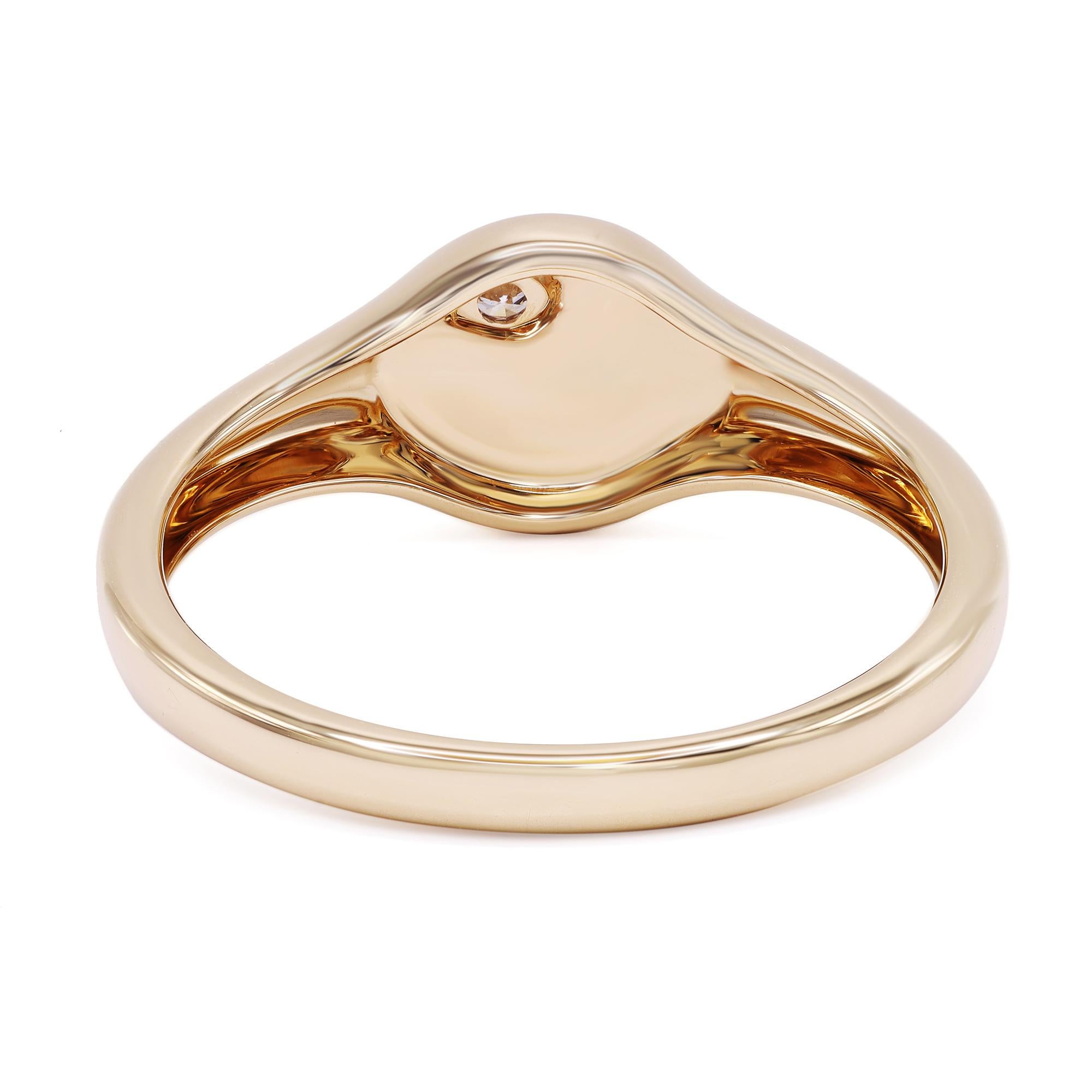 Bold look in a classic style, crafted in 14k yellow gold. This round signet ring features a round-cut diamond as a dose of sparkle to complement its high-polished solid gold finish. Total diamond weight: 0.03ct. Ring size 7. Width: 3.2mm. Weight: