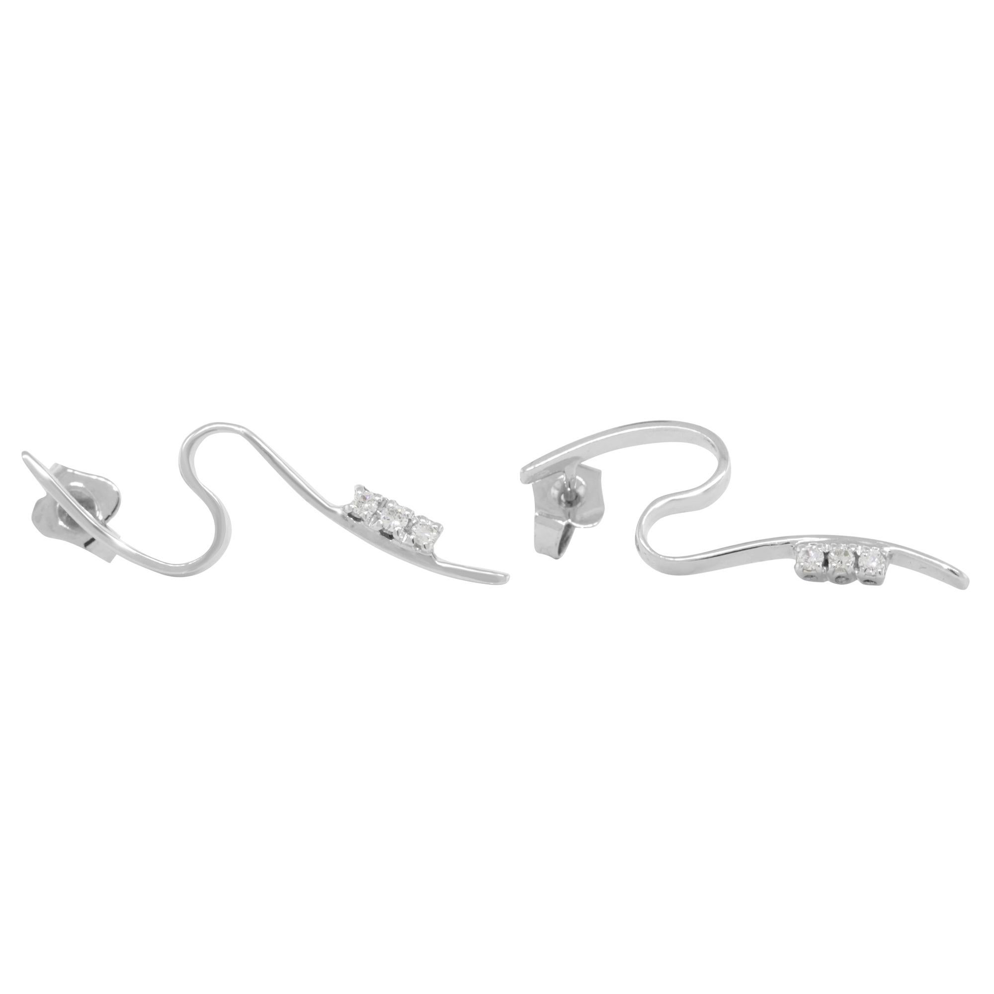 Feminine swirl and easy to wear these gorgeous diamond drop earrings are crafted in 18K white gold. These earrings make a perfect gift for Mother's Day or Birthday. Secured with push backings. The total diamond weight is 0.13ct. Earring length: 1.25